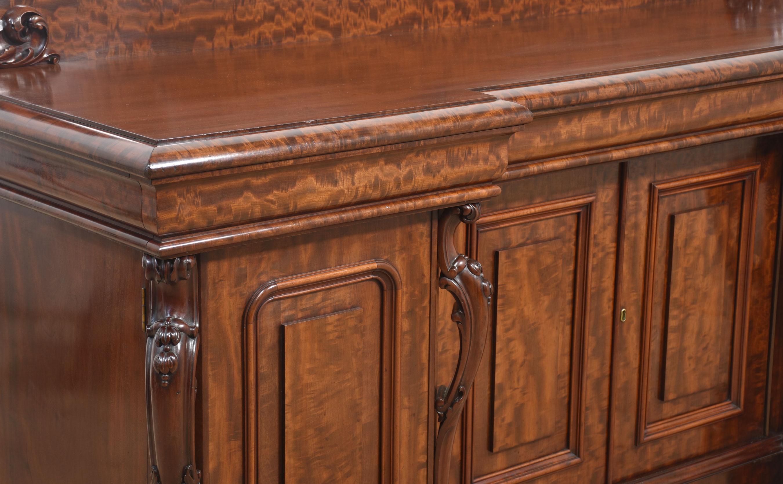 British Large figured mahogany breakfront sideboard For Sale