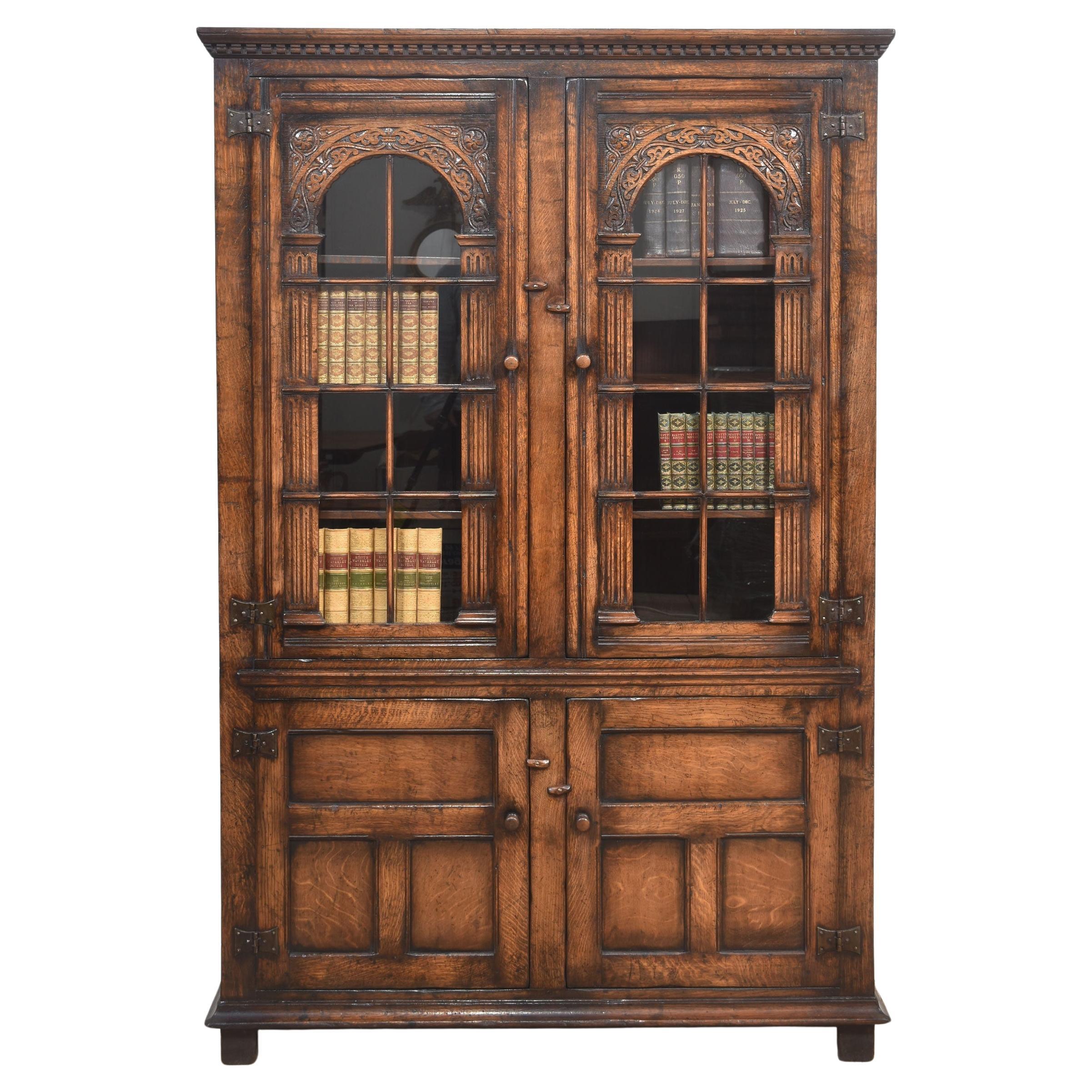 Solid oak two door bookcase For Sale