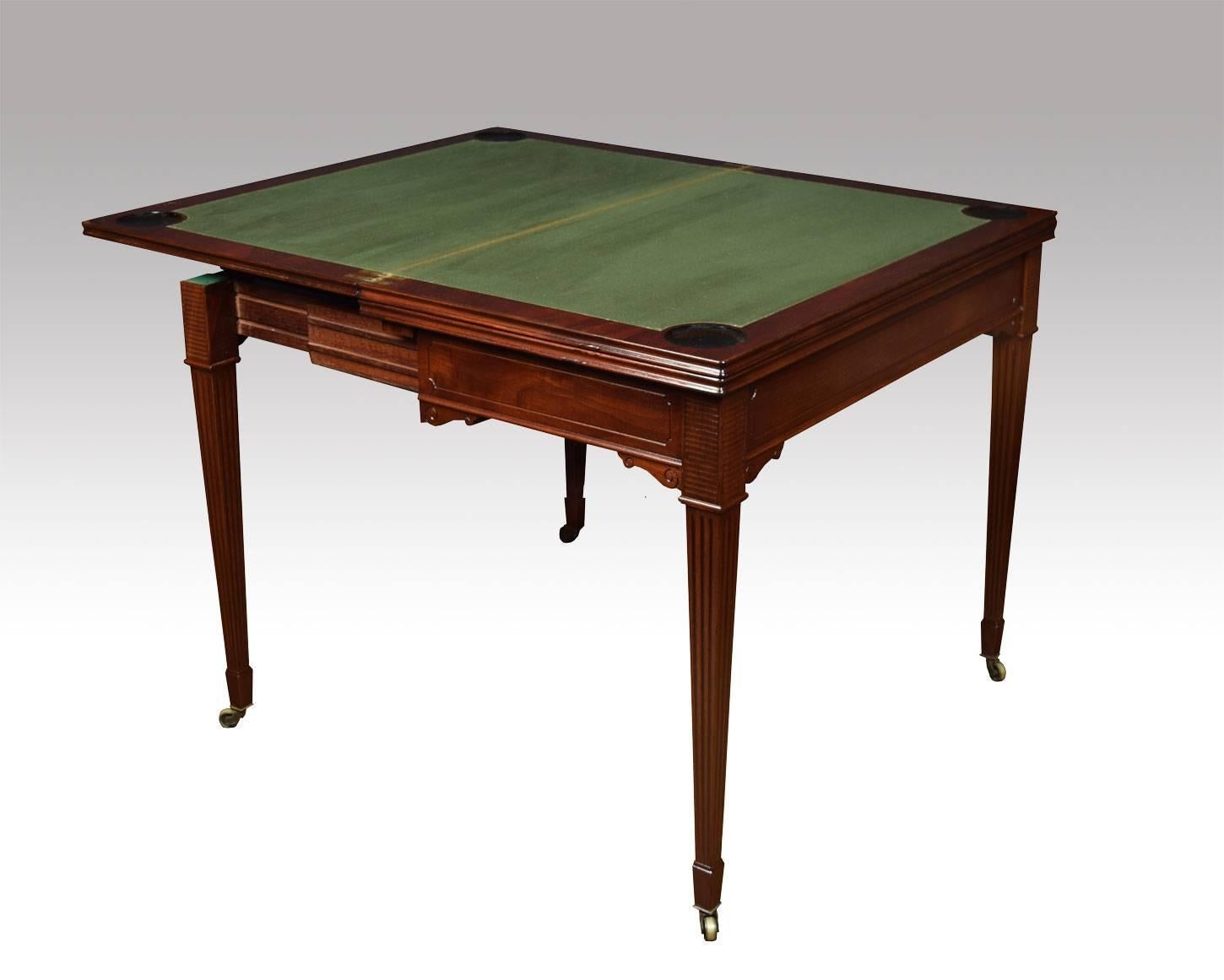 Edwardian mahogany triple top games table for cards and roulette. The large rectangular mahogany hinged triple top opens to reveal a gaming interior for playing cards and then opens again to reveal a Roulette table. The table raised up on solid