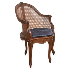 19th Century French Louis XV Style Walnut And Cane Tub Chair