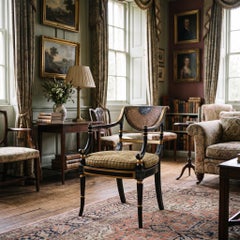 Regency Style Ebonised, Parcel-Gilt And Caned Armchair