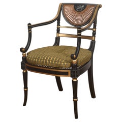 Regency Style Ebonised, Parcel-Gilt And Caned Armchair
