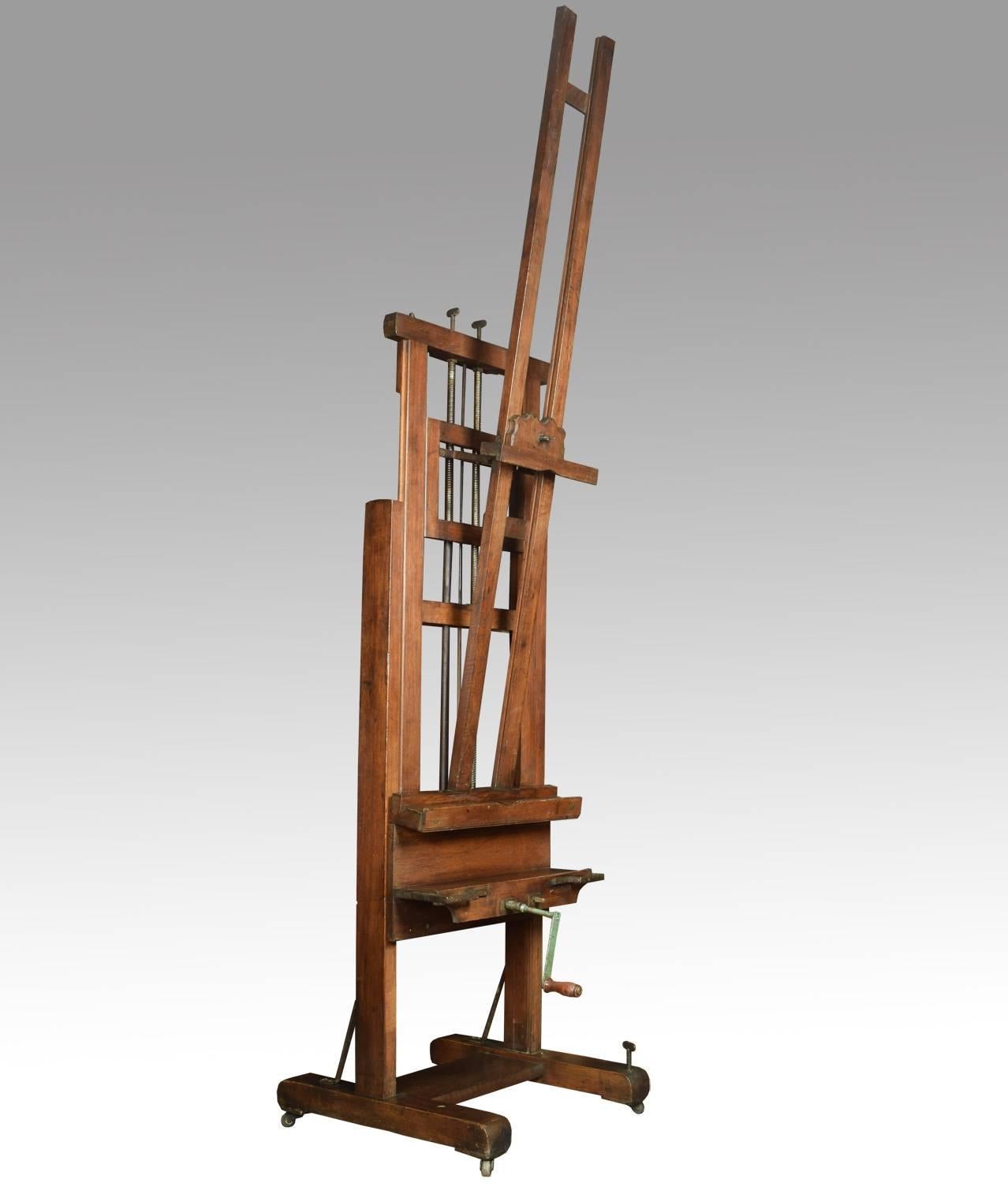 Large oak artist’s fully adjustable studio easel raised up on trestle base terminating in original castors.

Dimensions: 
Height 132 when fully extended 96 inches when closed.
Width 25.5 inches.
Depth 28 inches.