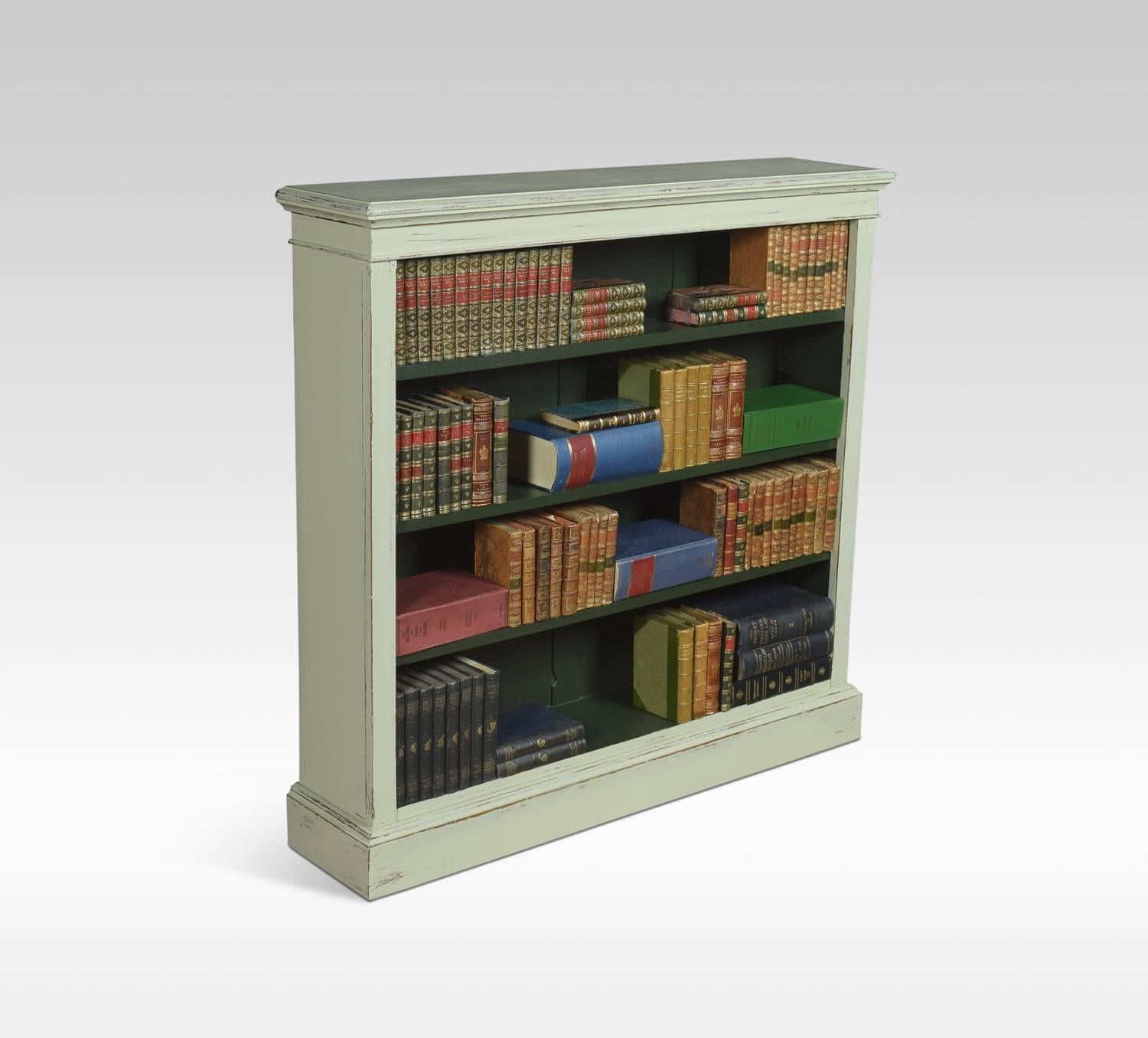 Edwardian painted open bookcase, the rectangular top above moulded. The bookcase having three adjustable shelves raised up on plinth base
Dimensions:
Height 47 inches
Width 48 inches
Depth 11 inches.
