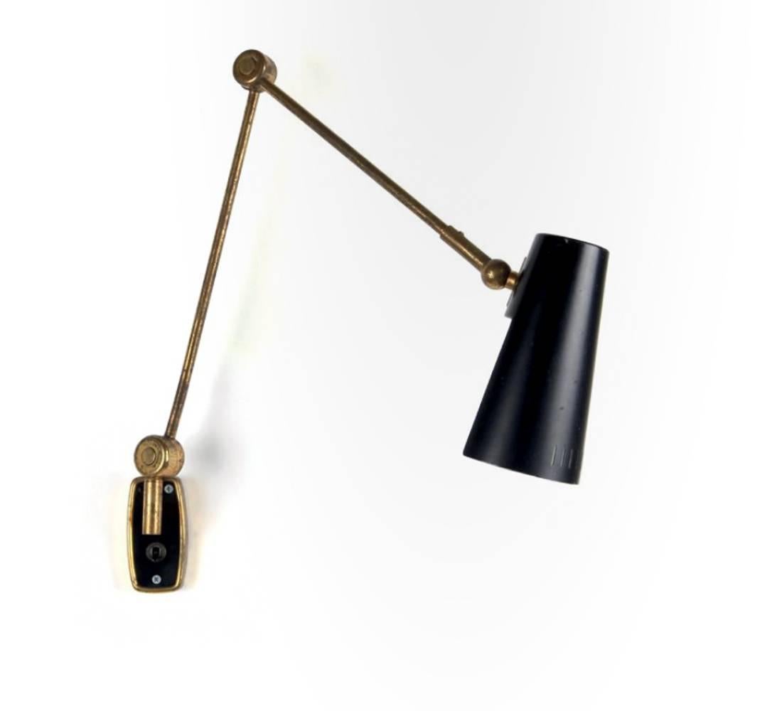 PRODUCER: Stilnovo - engraved Stilnovo Brevettato
No longer produced

Black lacquered perforated metal lampshade and movable arm in chromed metal

Bibliography : Stilnovo Catalogue