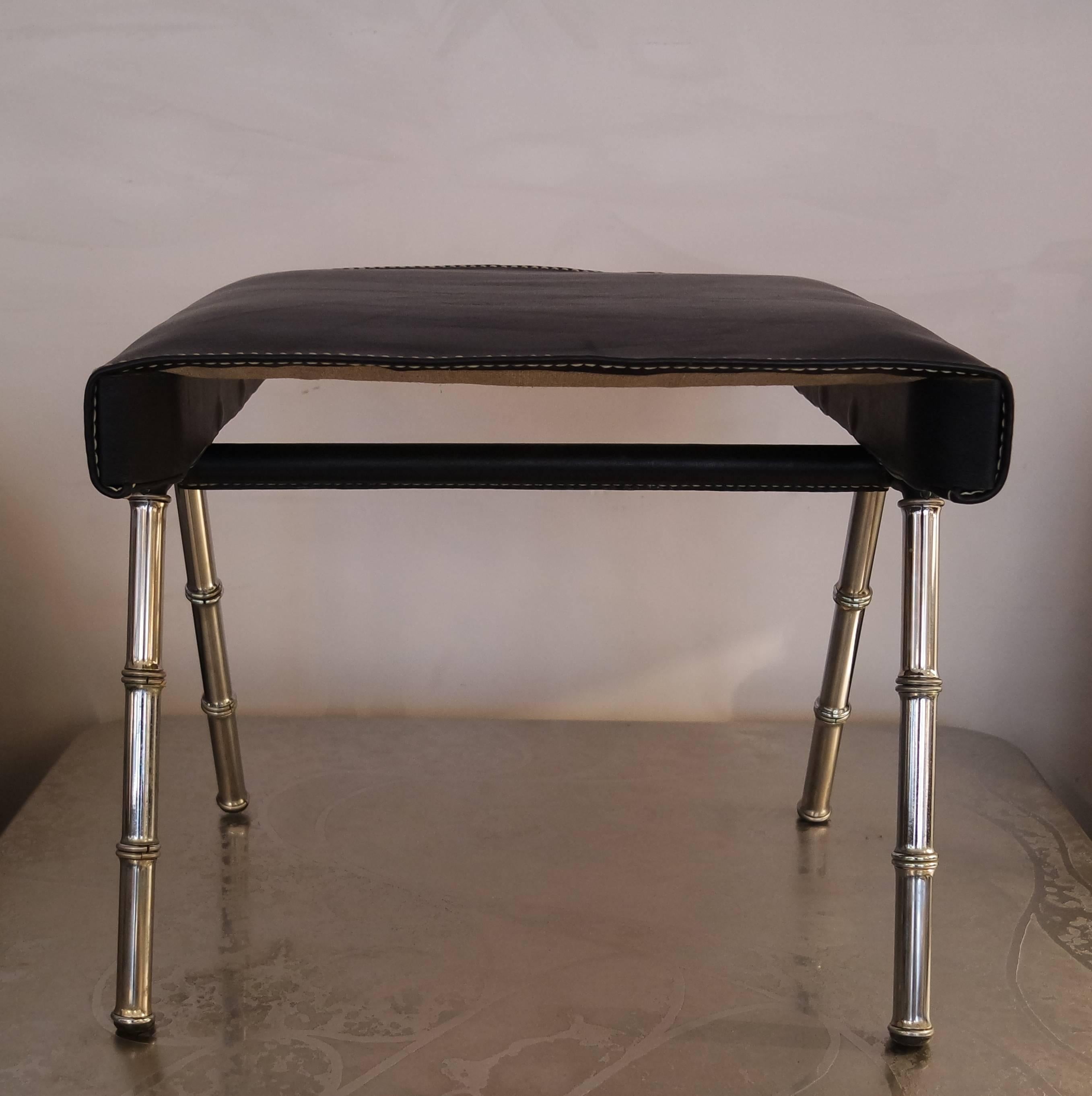 One stool designed by Jacques Adnet with chromed brass bamboo feet and deep blue leather hand stitched piqué sellier.