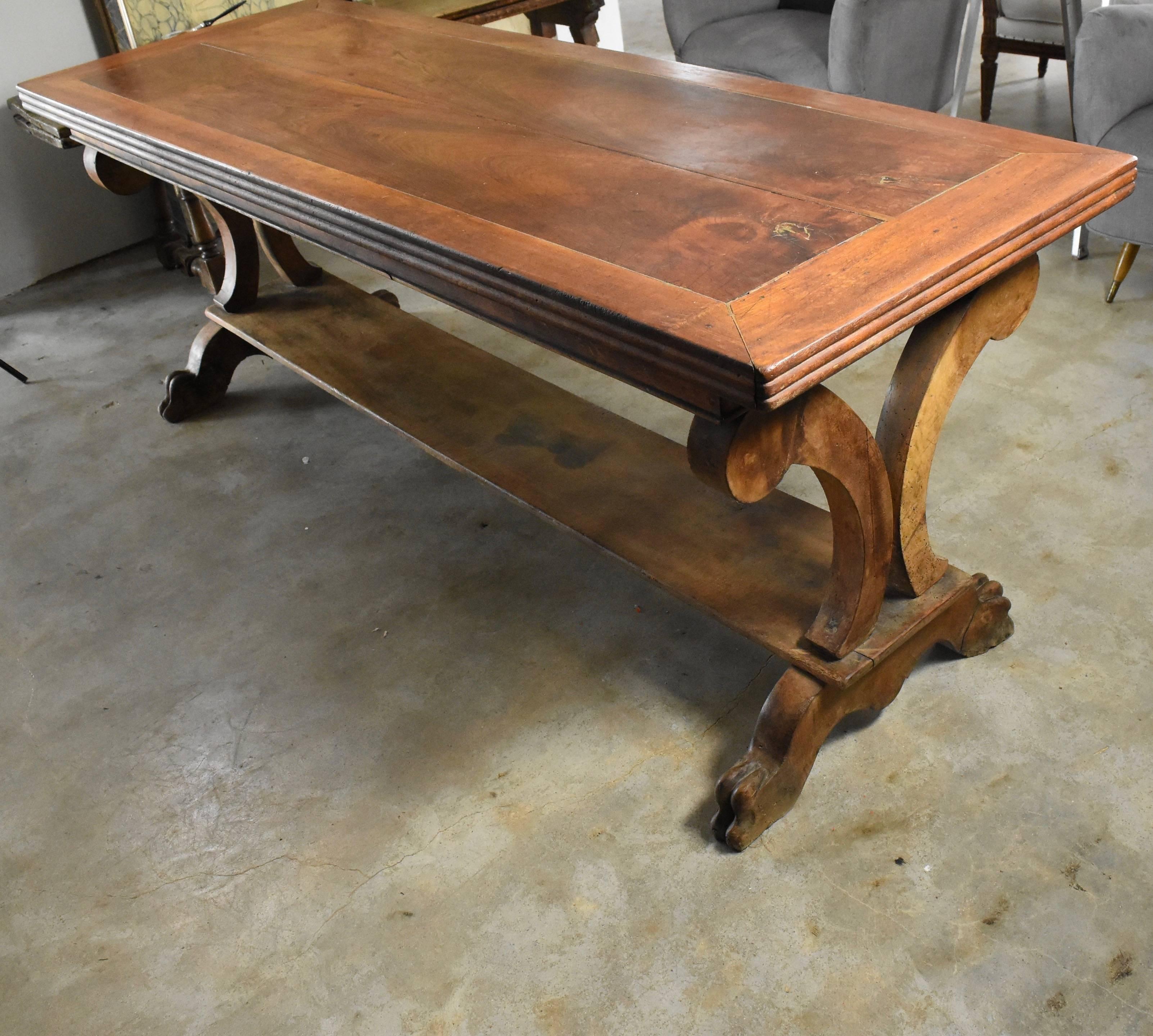 This is really a handsome walnut table from France. It makes the perfect desk or console that can float as it's finished all the way around. It features hand-carved lion claw feet and is very structurally stabile.
Skirt bottom to floor measures