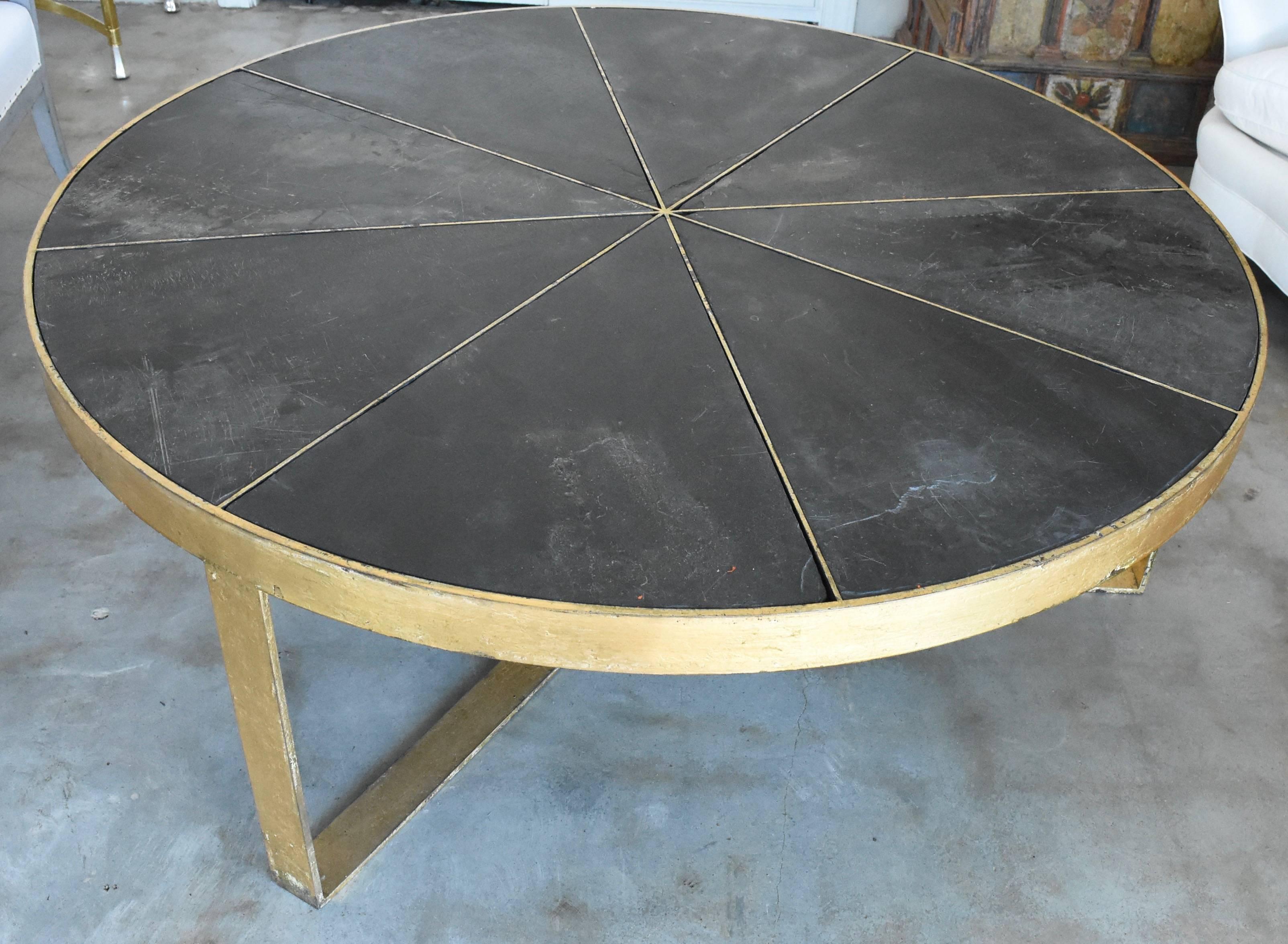This is fabricated for me in Spain. It is beautifully made with steel then gold leaf. It features slate that insets into the pie shaped top that can be removed for shipping. This one is sold and another is in transit and due in February 2019
I have