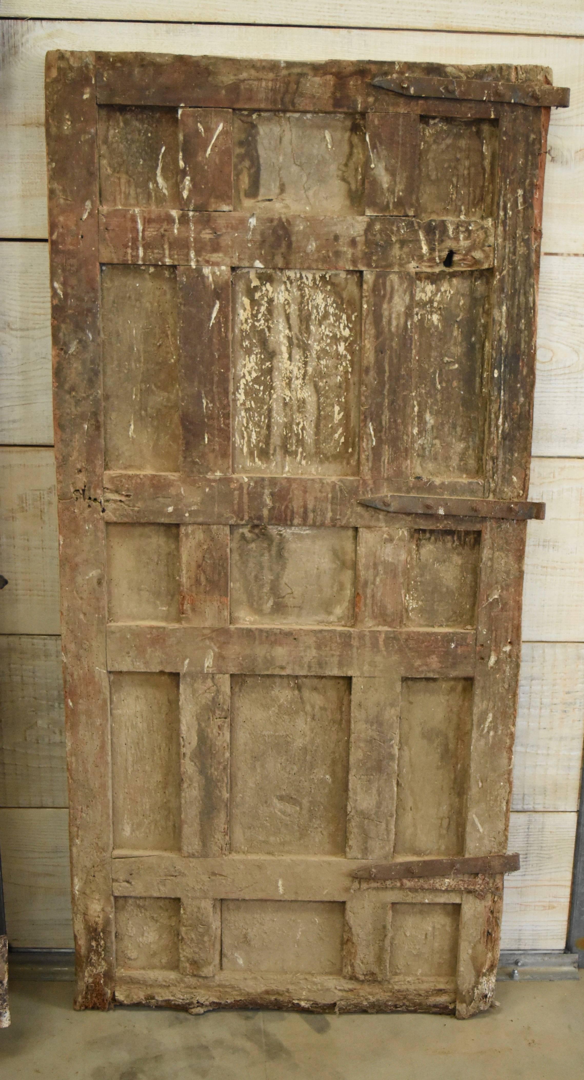 17th Century Spanish Chestnut Door with Iron Hardware In Distressed Condition In Houston, TX