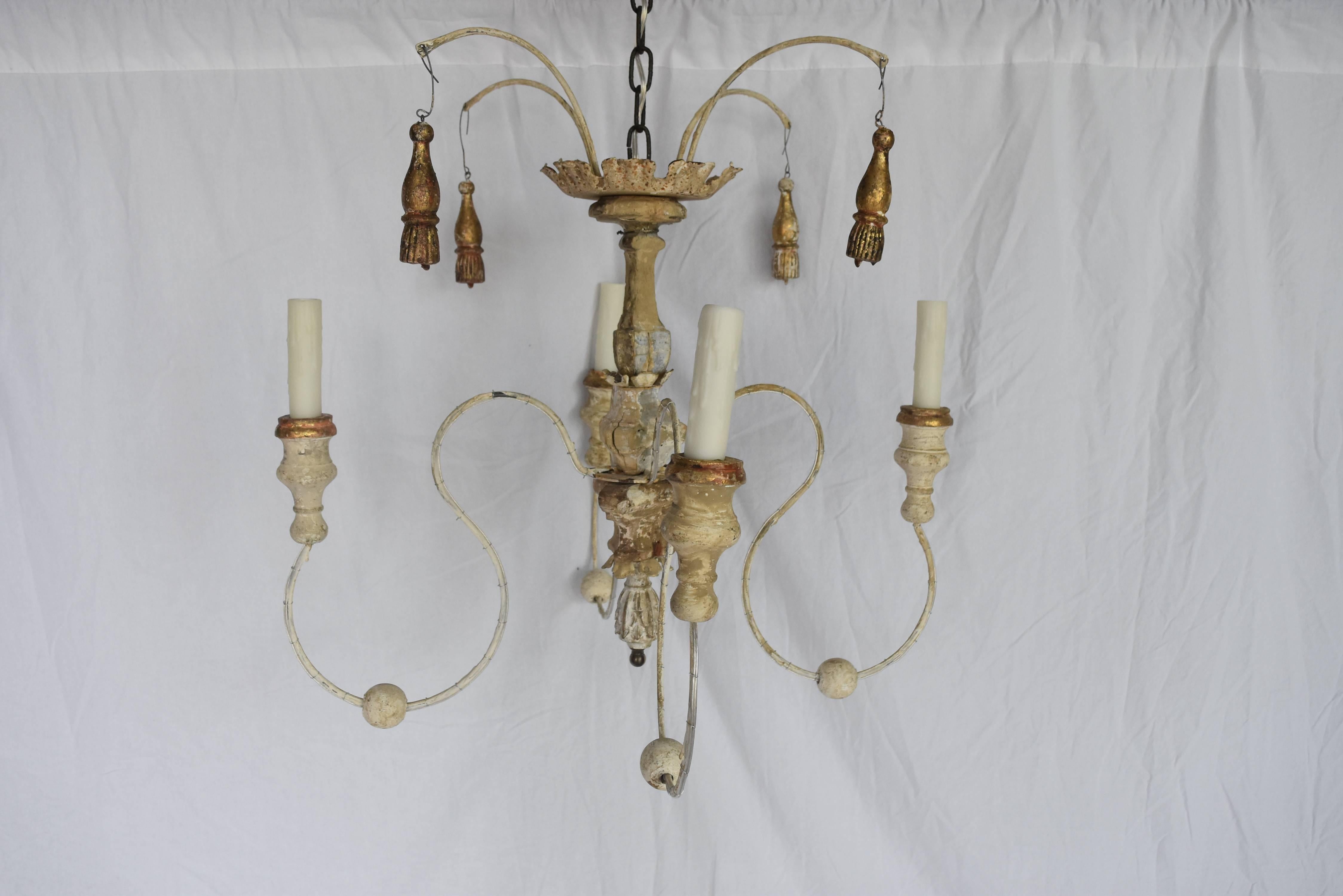 This is a charming one of a kind spider chandelier from Italy that has been made with 18th century church altar elements and new iron and bobeches. It has been newly wired with a 12