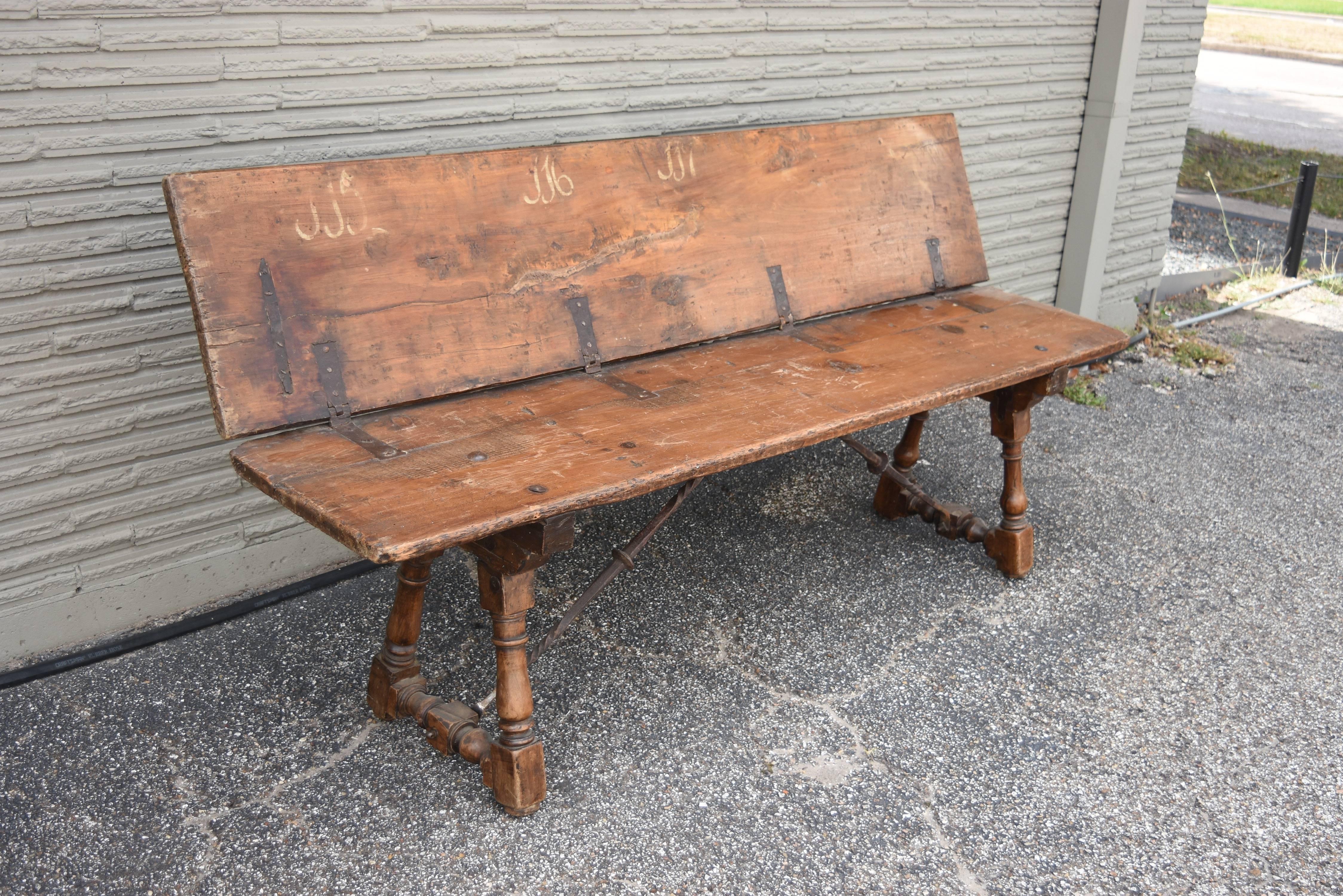 This is a rare formerly church bench that folds down. It has the original hardware and hand-painted letters, numbers on it. It is pegged and has a beautiful warm patina from central Italy.
