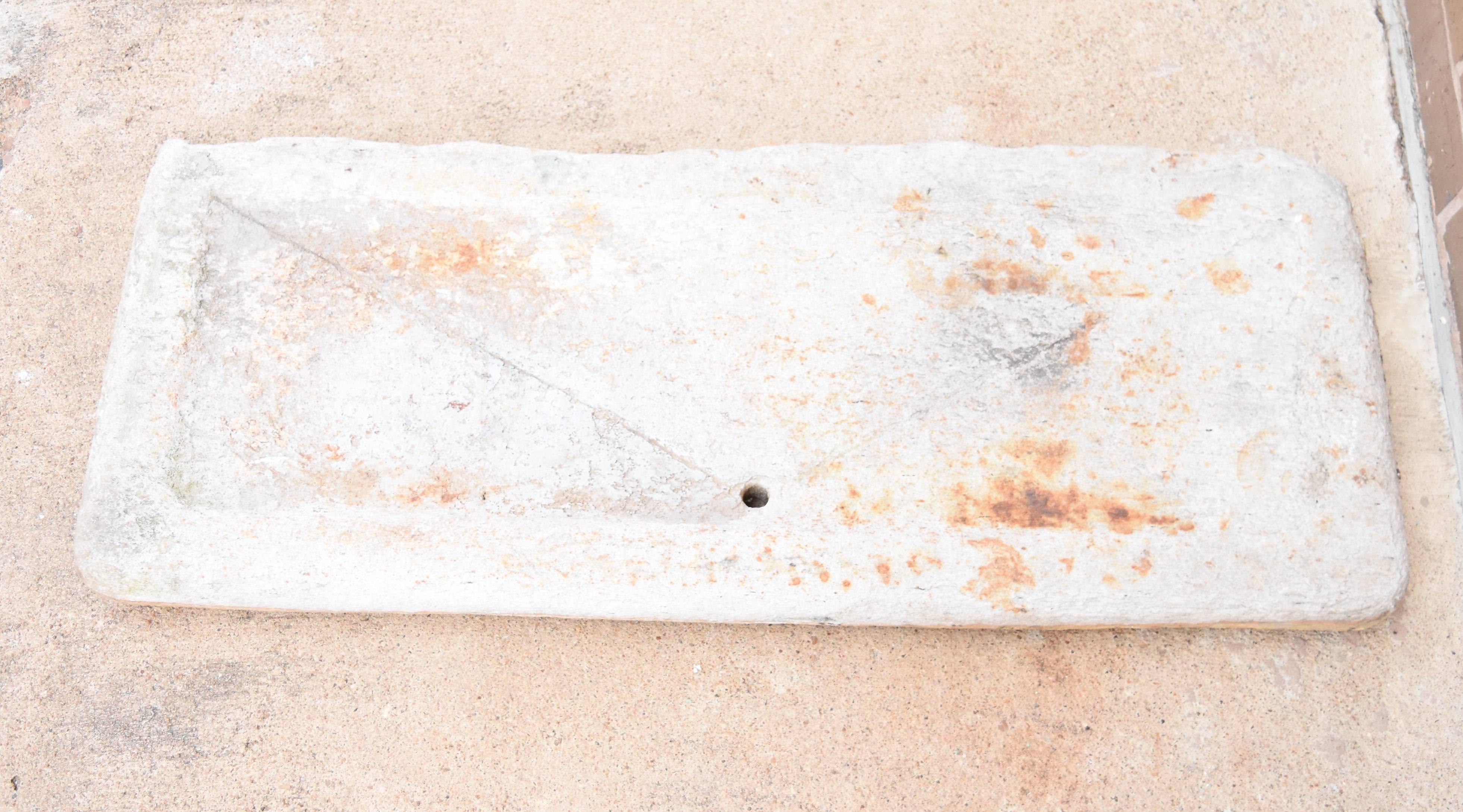 This is a one of a kind 18th century Italian sink that was used in a garden . It does have some rust stains but it gives it the character and represents it's age as well. You can see that it has been scored so the water drains to the centre.