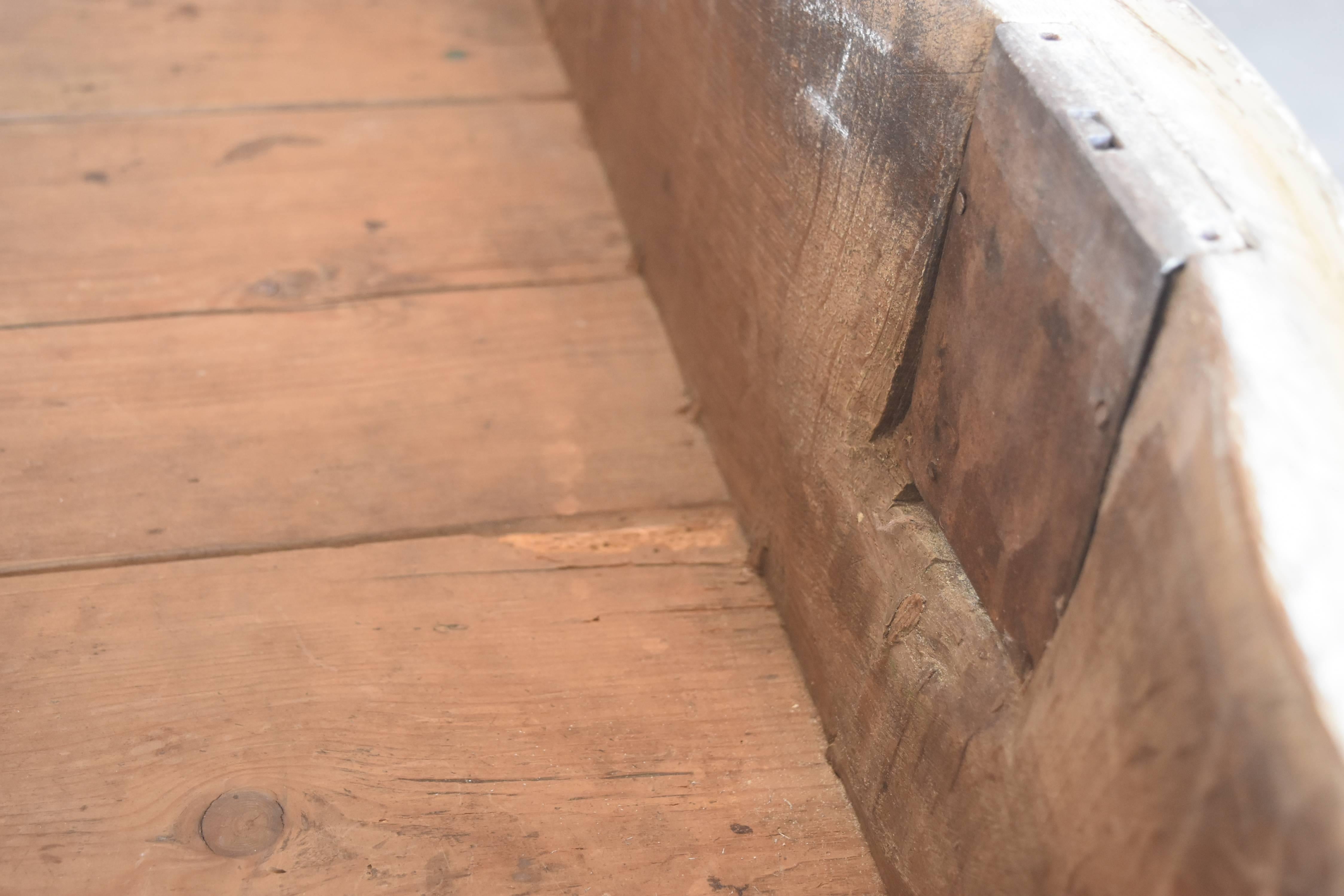 This is a very well made heavy oak chest from the early 19th century. It's very well constructed. I think the pulls have been changed at some point but they are correct for the piece. The paint looks gray and white. The top has been scraped back.