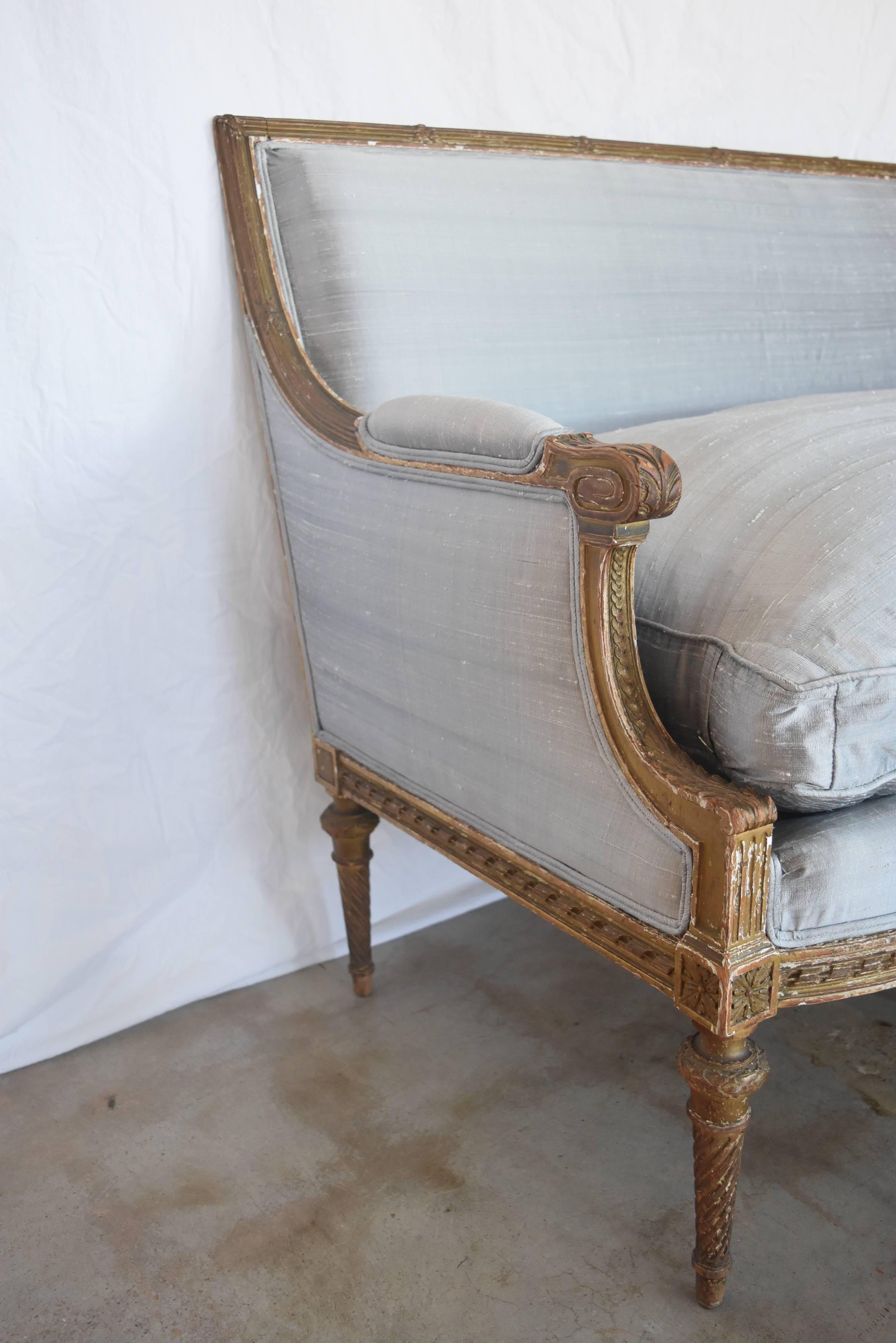French Louis XVI has always been one of my favorite styles. Whether you want an dressy, casual, modern, or traditional look, it always works. This one is in great condition. It's hand-carved, the gilt is original and there is a little wear on the