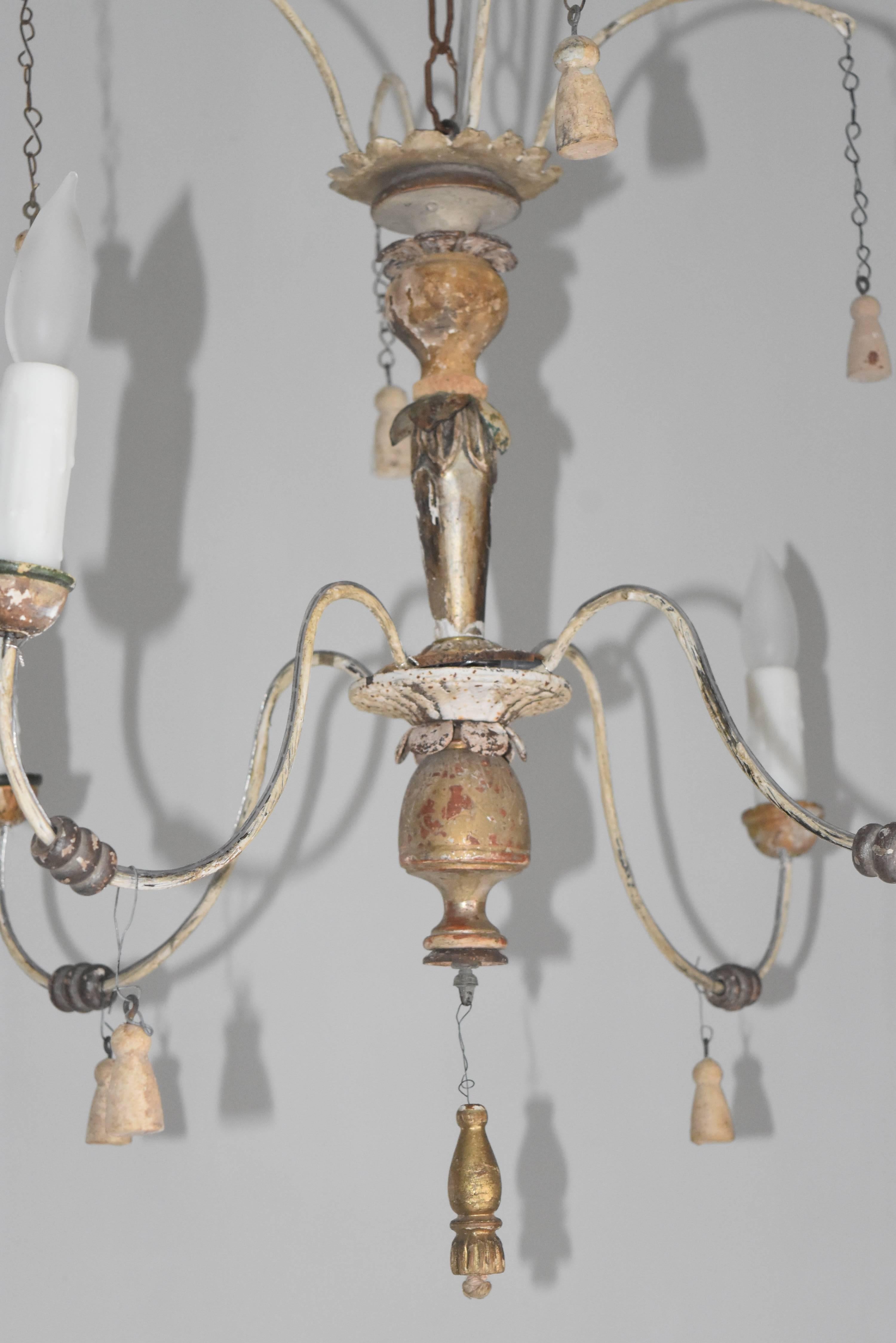 This is a whimsical, one of a kind, hand made wood and metal chandelier that has been made from 18th, 19th Century altar elements .  It's that perfect little something for that special powder room or anywhere you need a airy four-light chandelier.