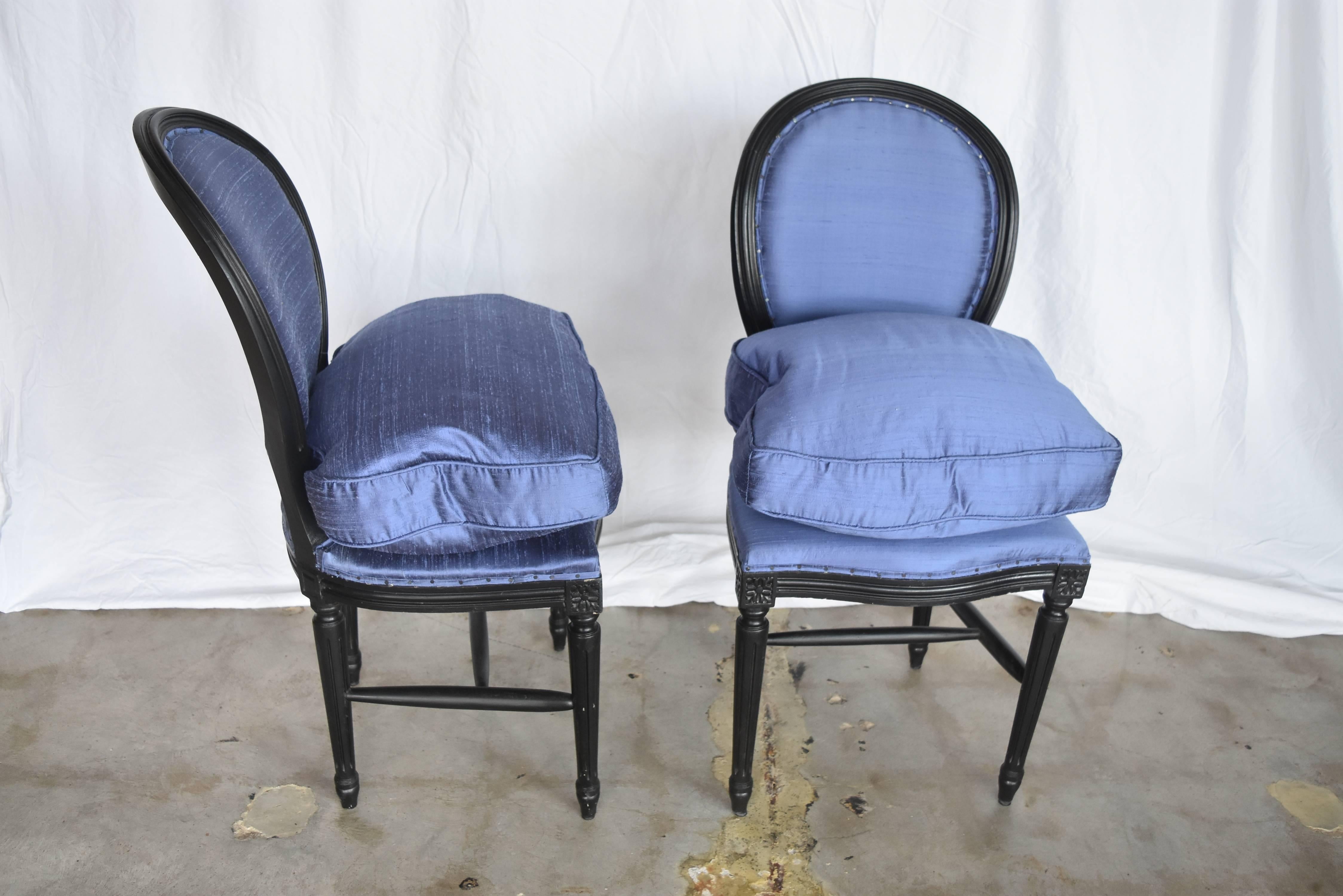 These Louis XVI chairs are from France. They have been painted black and upholstered in silk with down cushions made to give more comfort and height.
Seat height without cushion is 18