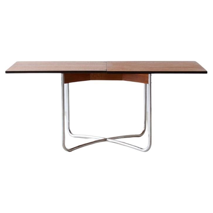 Extendable Bauhaus dining table made of tubular steel and veneered table tops For Sale