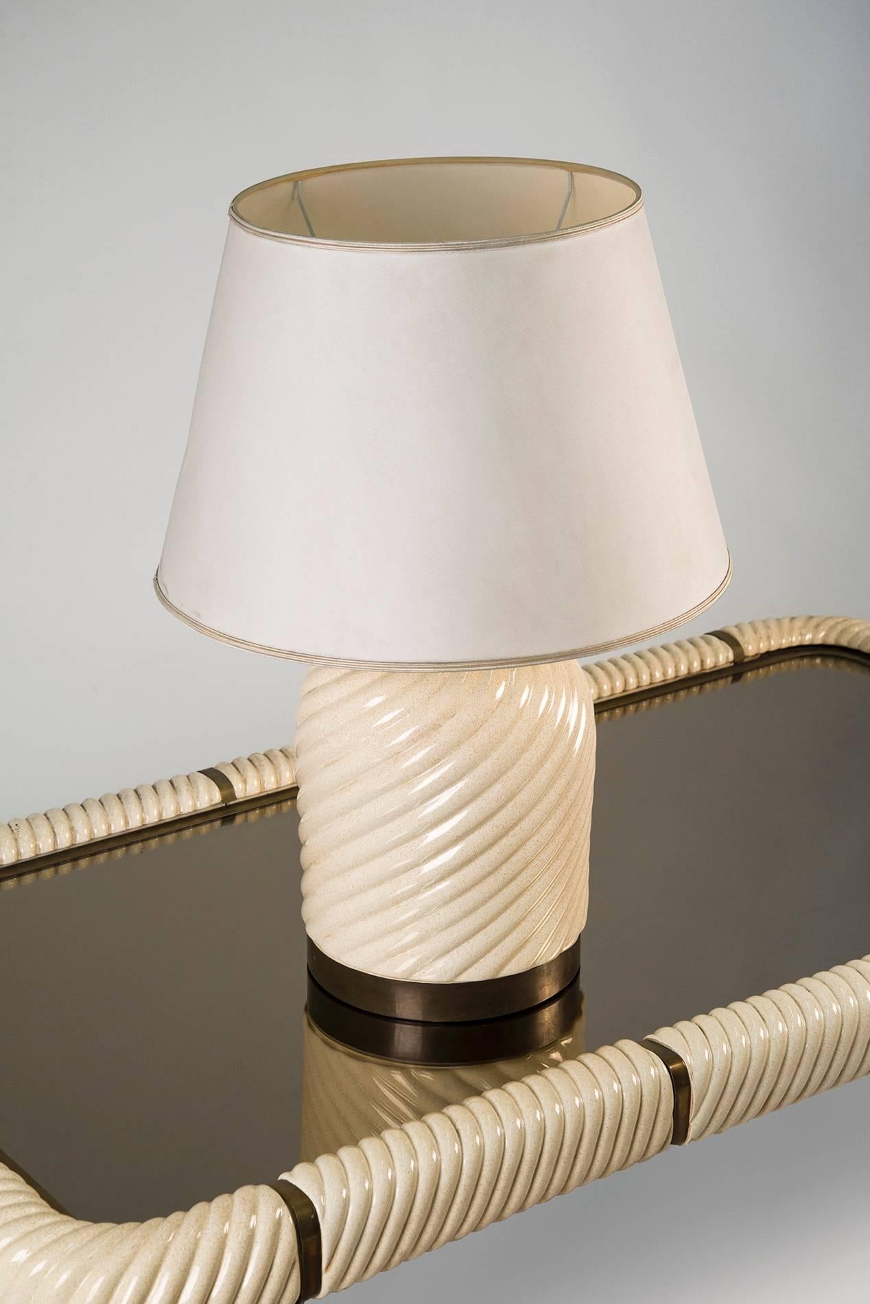 Table lamp designed by Tommaso Barbi, Italy, 1970. Spiral ceramic structure with brass base, fabric shade. The internal part is marked and labeled. Very good original conditions.
