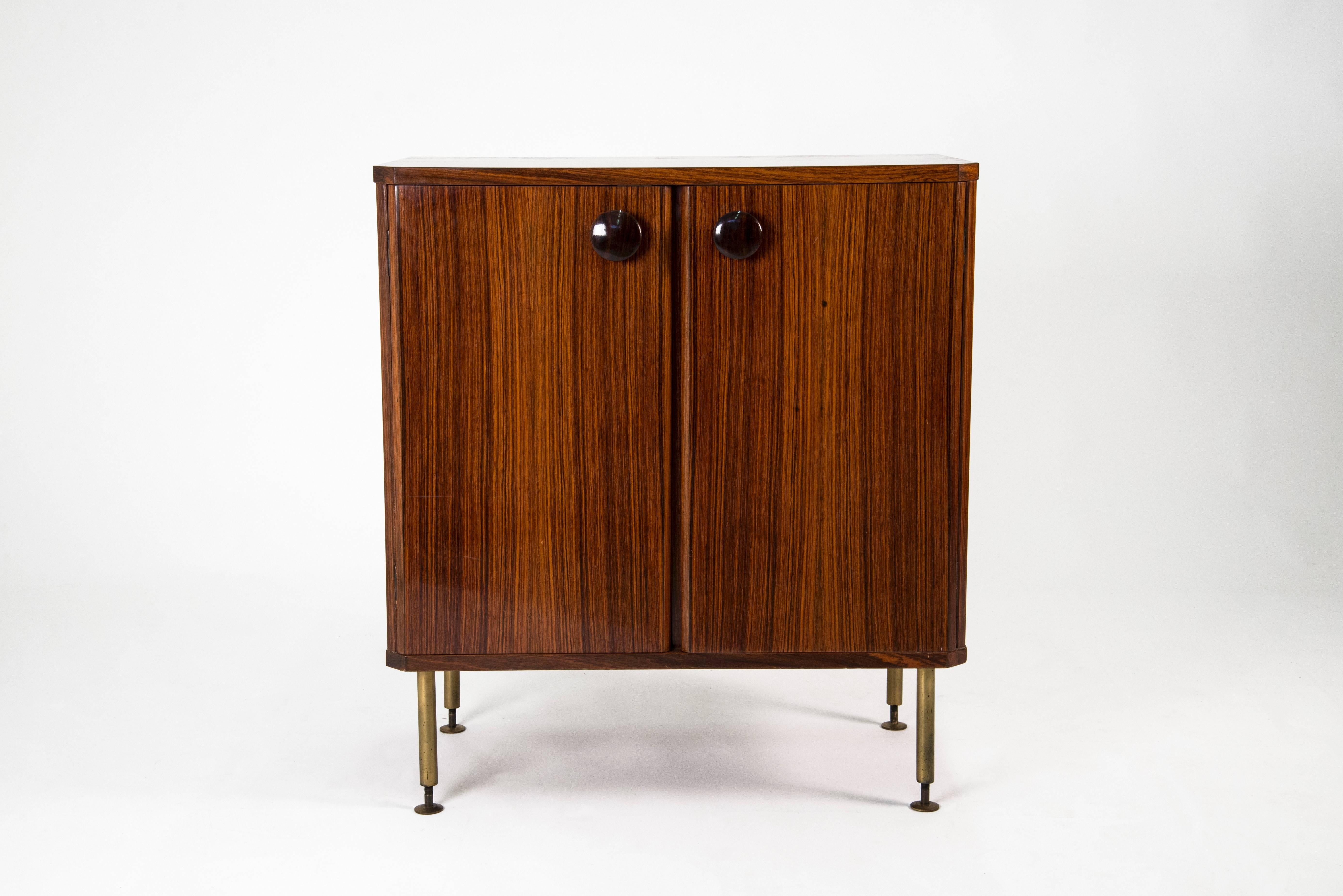 Set of three sideboards designed by Sergio Mazza for a private commission in 1959. Walnut structure with brass adjustable feet and lacquered wooden handles. The internal space is organized as shown in the images. The one with the yellow inside is a