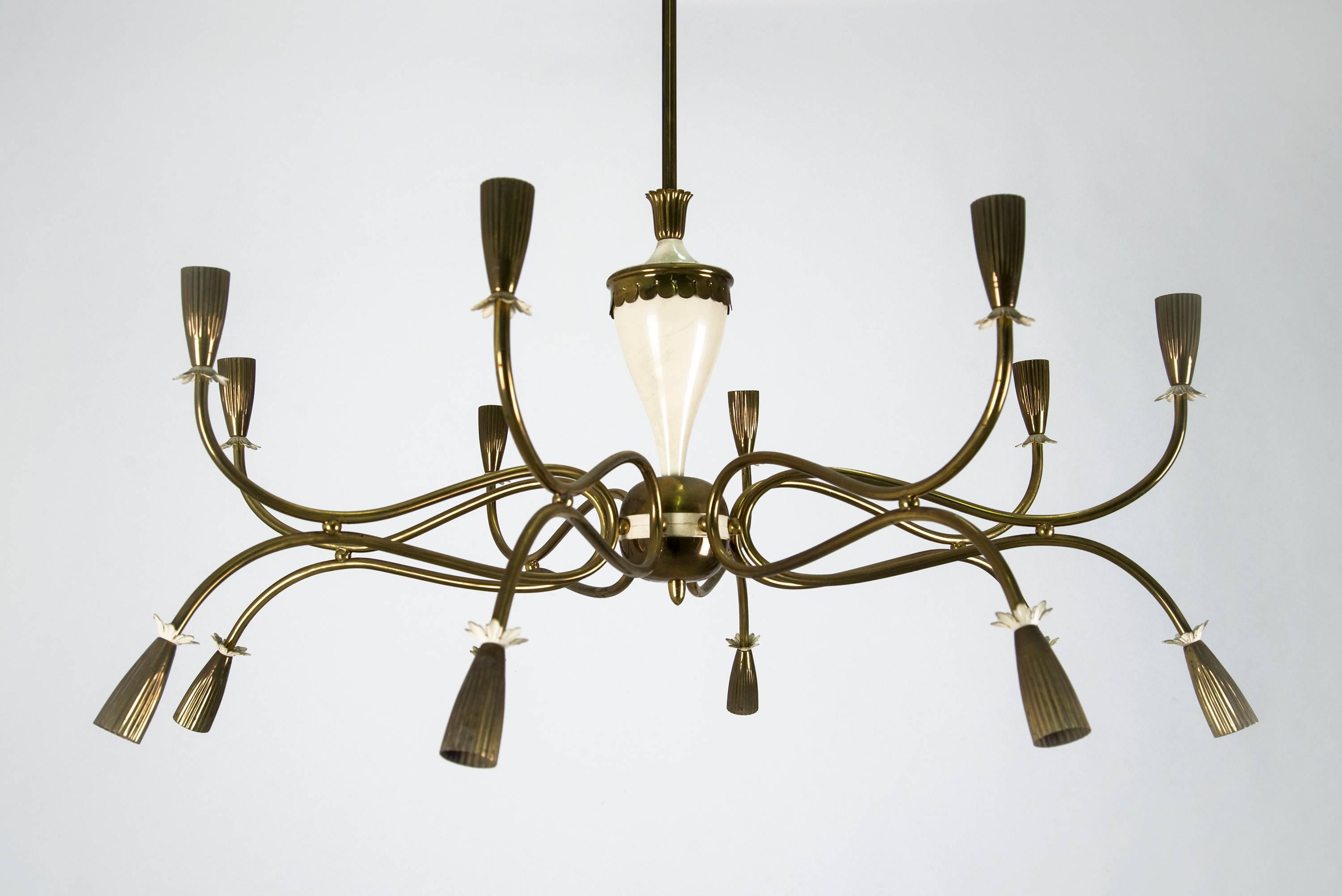 Large and elegant sixteen-light chandelier in the style of Paolo Buffa, manufactured in Italy in the 1950s. Brass and lacquered metal structure. Good original vintage conditions.