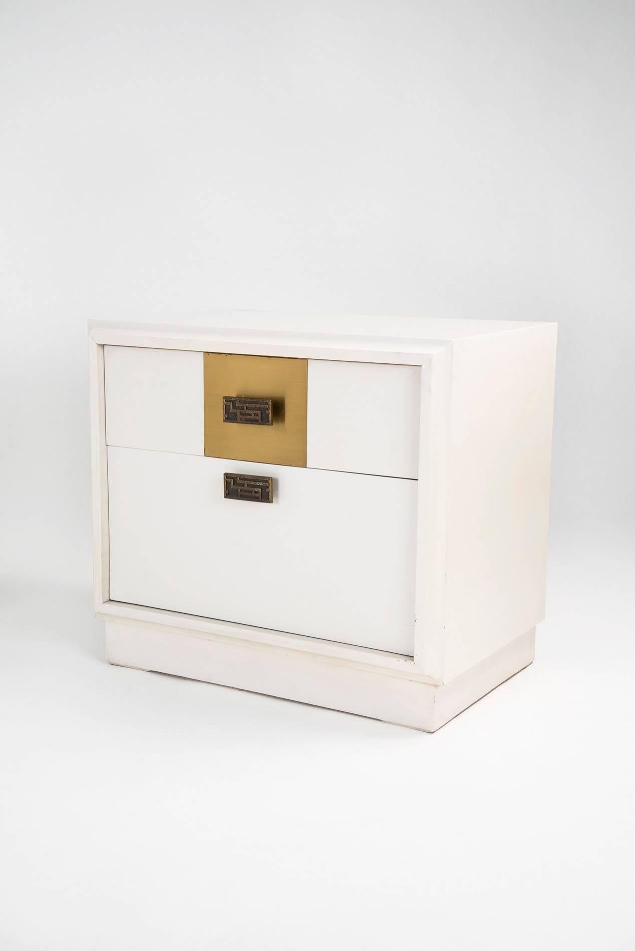 Pair of elegant nightstands designed by Luciano Frigerio for Frigerio in the 1970s. White lacquered wooden structure, brass decorations, bronze handles. Good original vintage conditions.