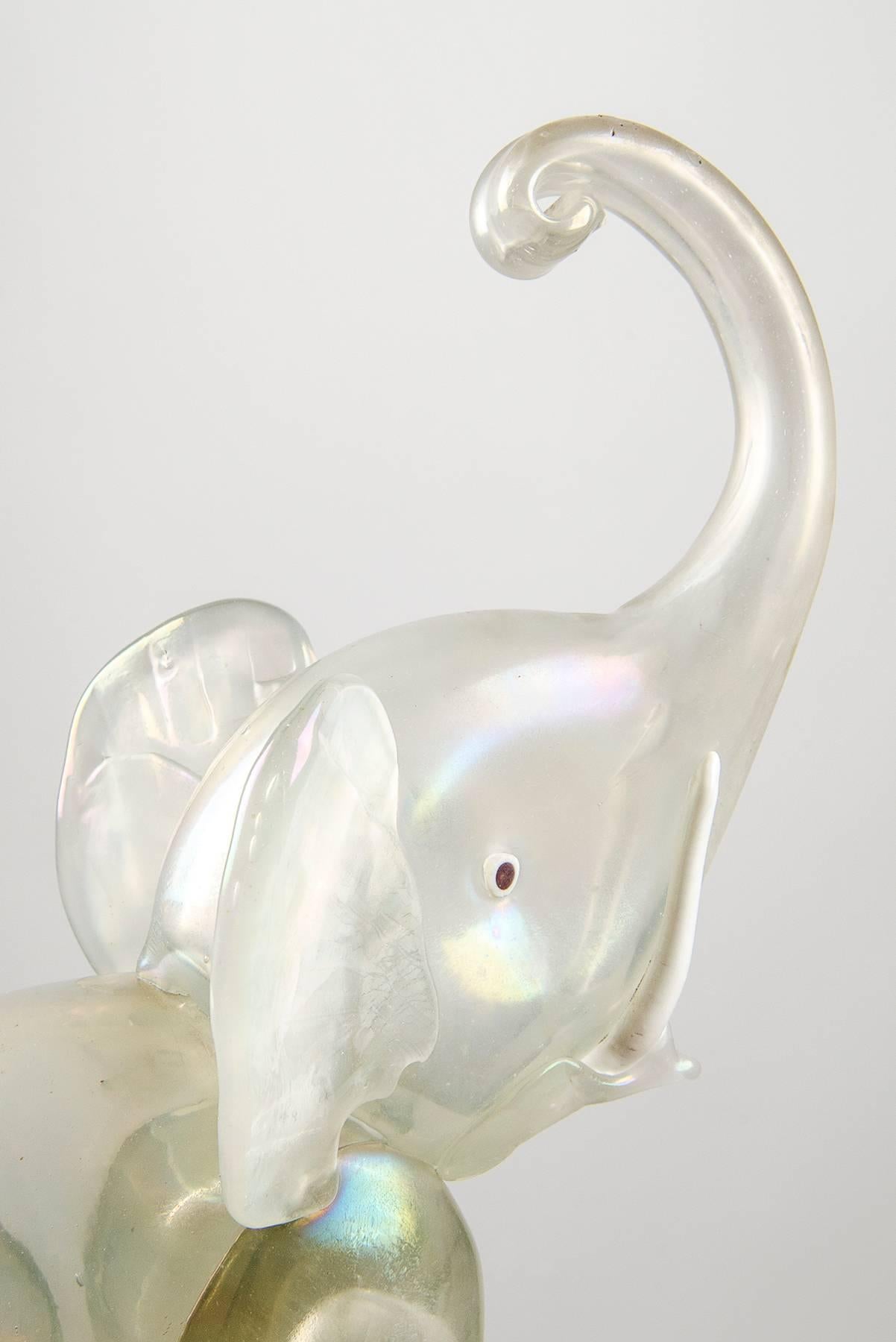 Exquisitely made Murano glass elephant sculpture, probably one of Barovier&Toso or Seguso's creations from the early 1930s.  Charming translucent and iridescent glass. Good vintage conditions, just a few minor losses on the tail on one leg to