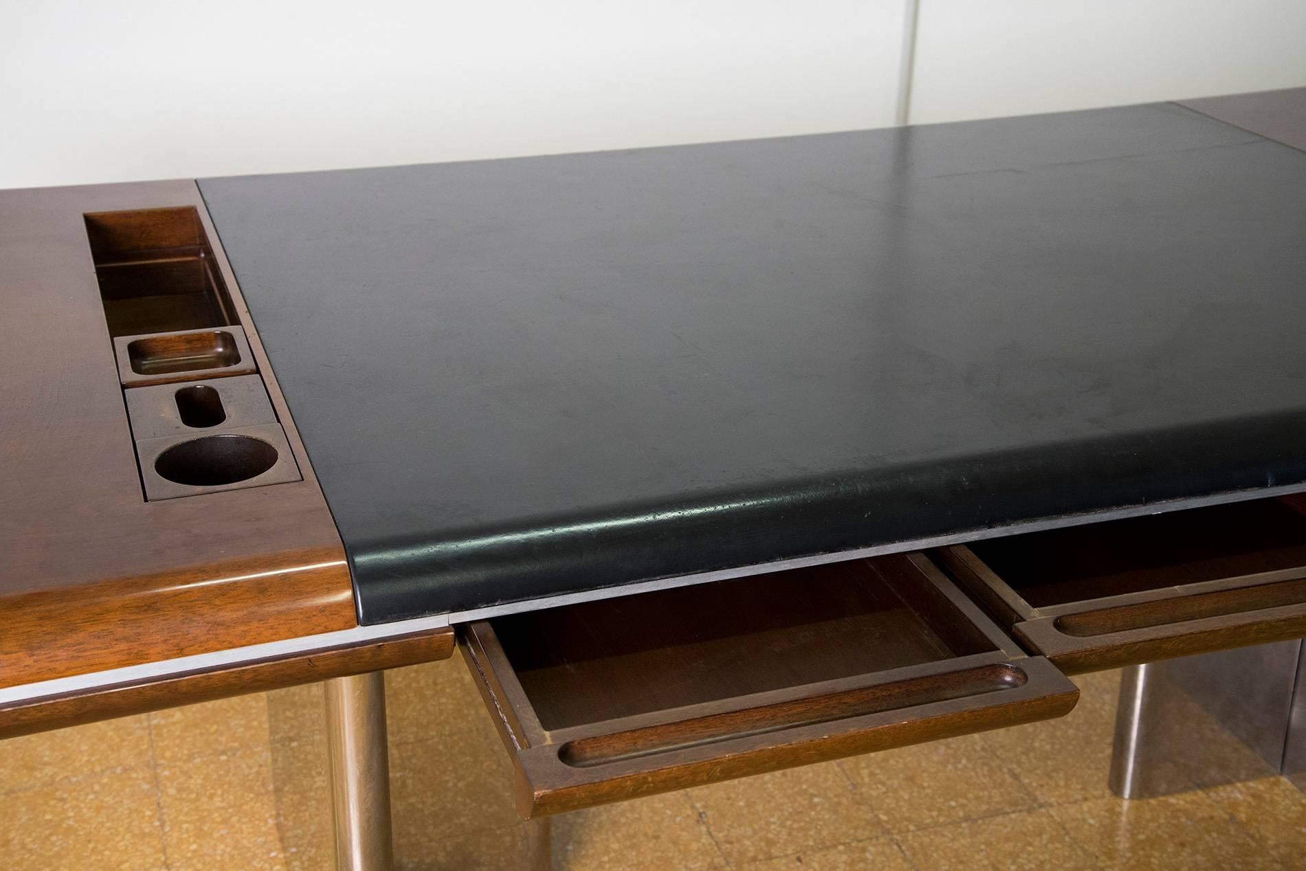 Massive executive desk designed by Hans Von Klier for Skipper in 1970. Stainless steel legs, top in rosewood and black leather with organizing elements, three desks. Good original vintage conditions.