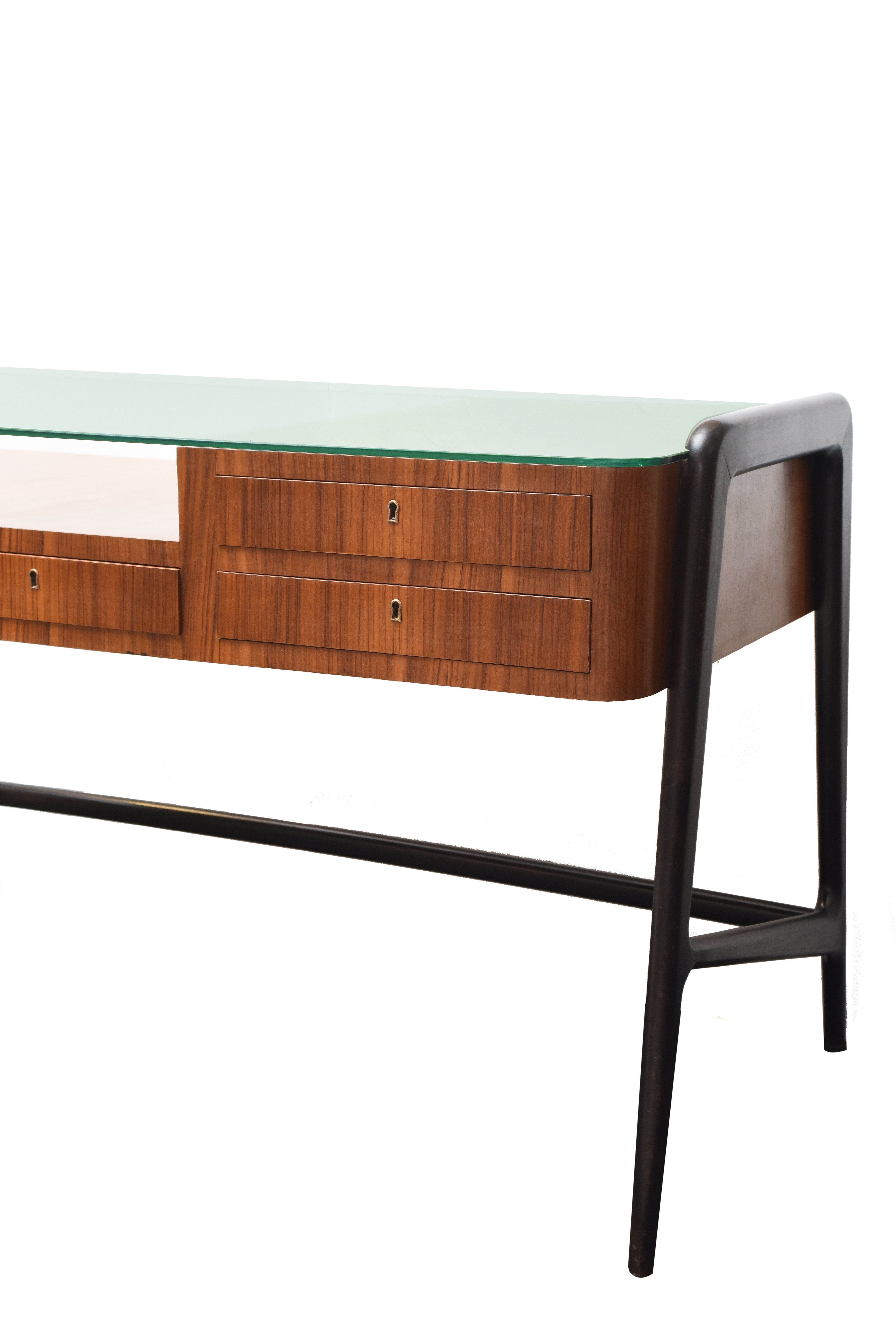 Desk with four drawers in ebonized and striped wood.
Top in glass.
Designed by Vito Latis, Italy, 1950s.
Measures: Cm 137.5 x 69 H cm 81.5.