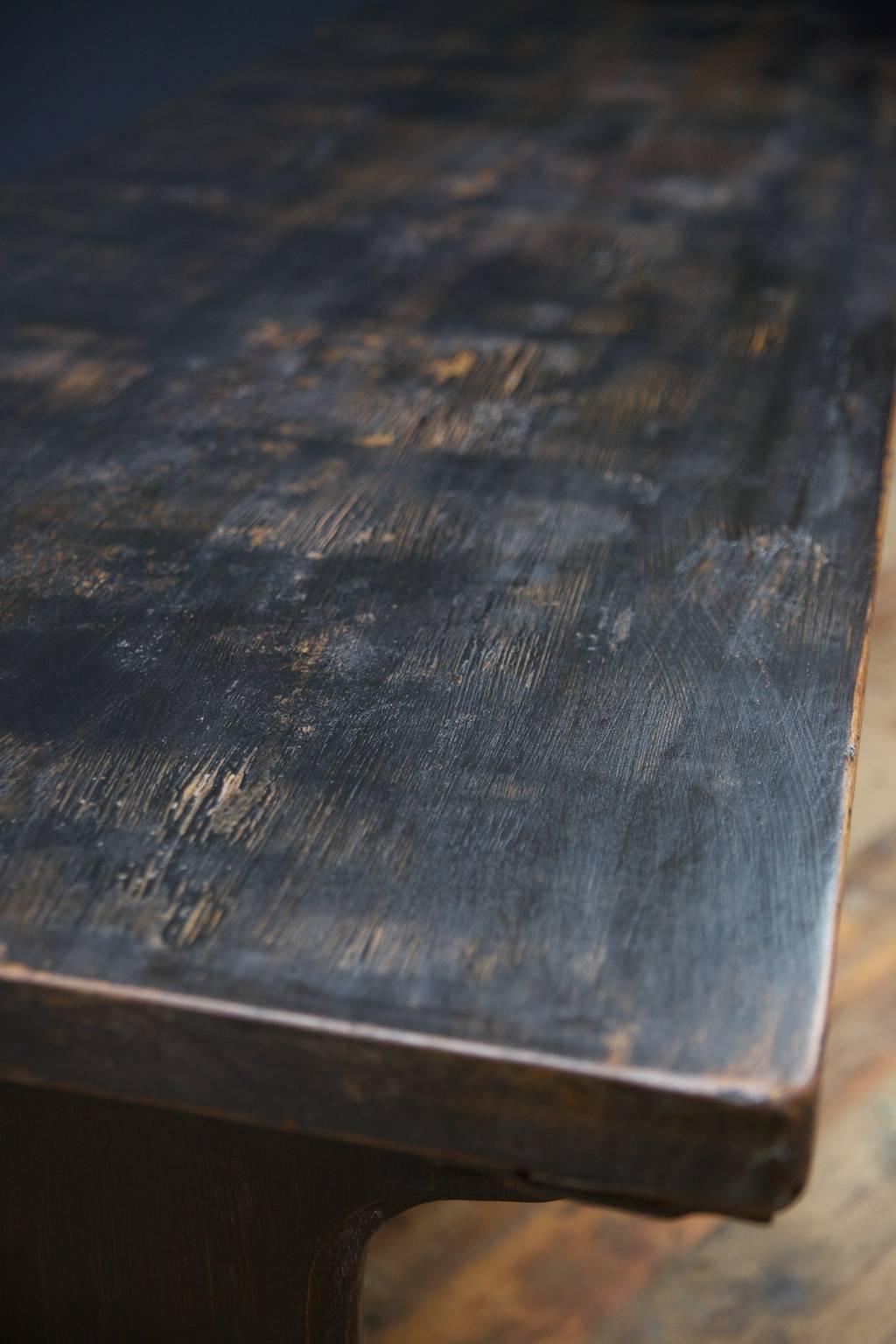 Large oak painted refectory tables in the gothic manner.
Made for Lincolns Inn fields law courts, London, latterly used in Lympne Castle, Kent.
Thick three plank top, worn and crackled black painted surface to both, low central