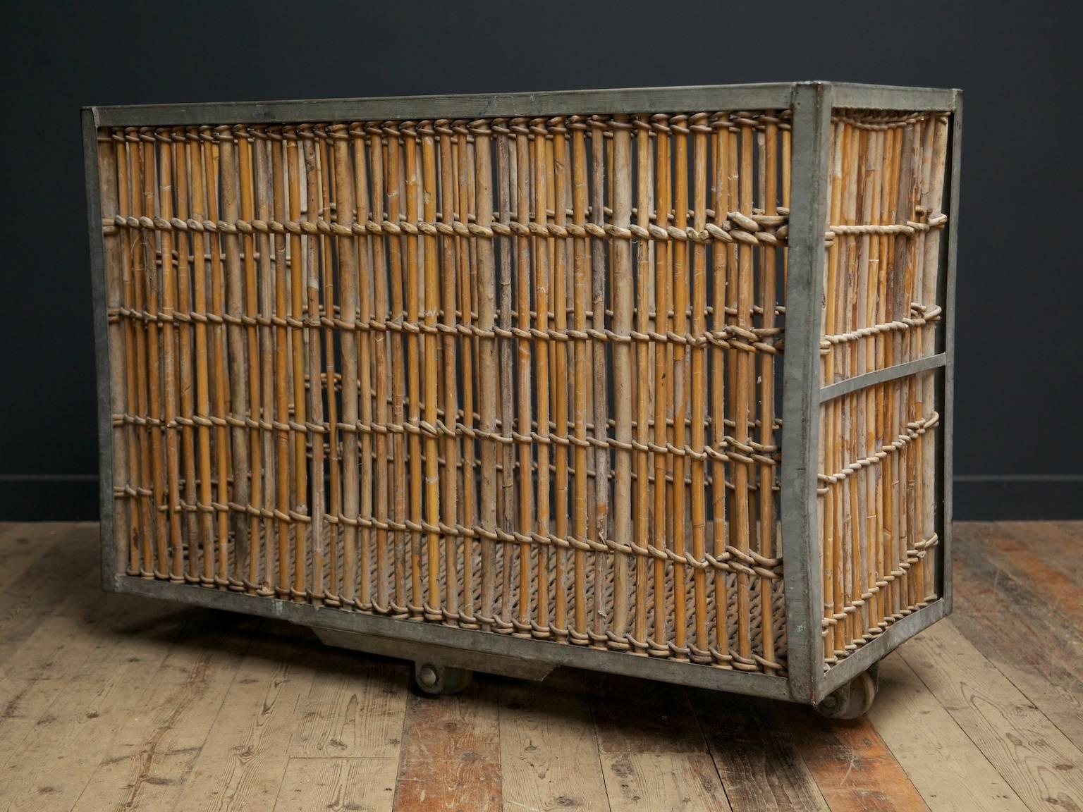 Factory mill trolley.

Galvanised steel frame with inset bamboo panels raised on off set castors,

English, mid-20th century.