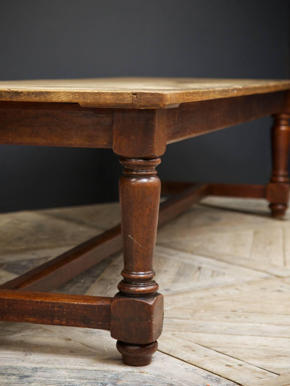 A superb oak and teak refectory table.

The planked oak top supported on turned teak legs and low central stretcher.

English late 19th century.

Excellent Provence.
         