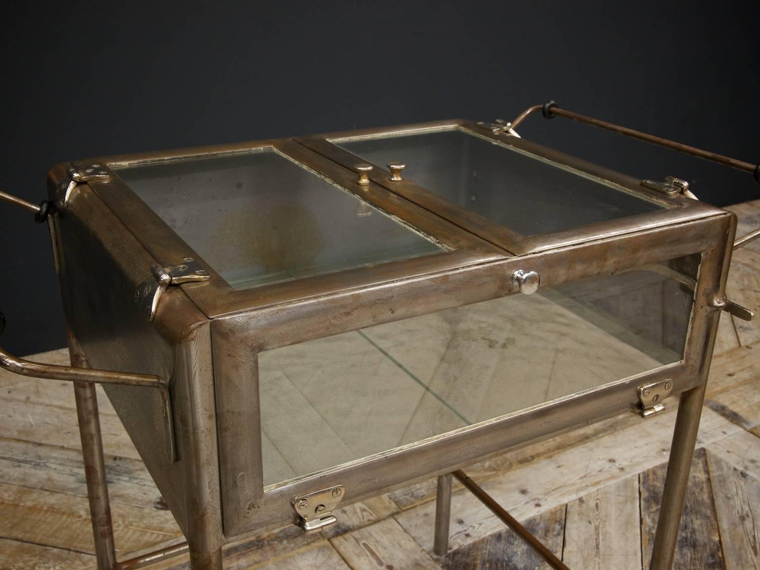 A superb and scarce glazed cast iron medical instruments display case.

Multiple opening sections, chrome hinges, stripped to bare surface and waxed.

German, circa 1910.
  
