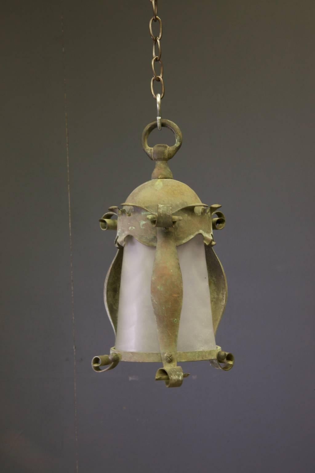 A small Art Nouveau copper lantern with its original mouth blown glass cylinder shade,

English, 1930s.