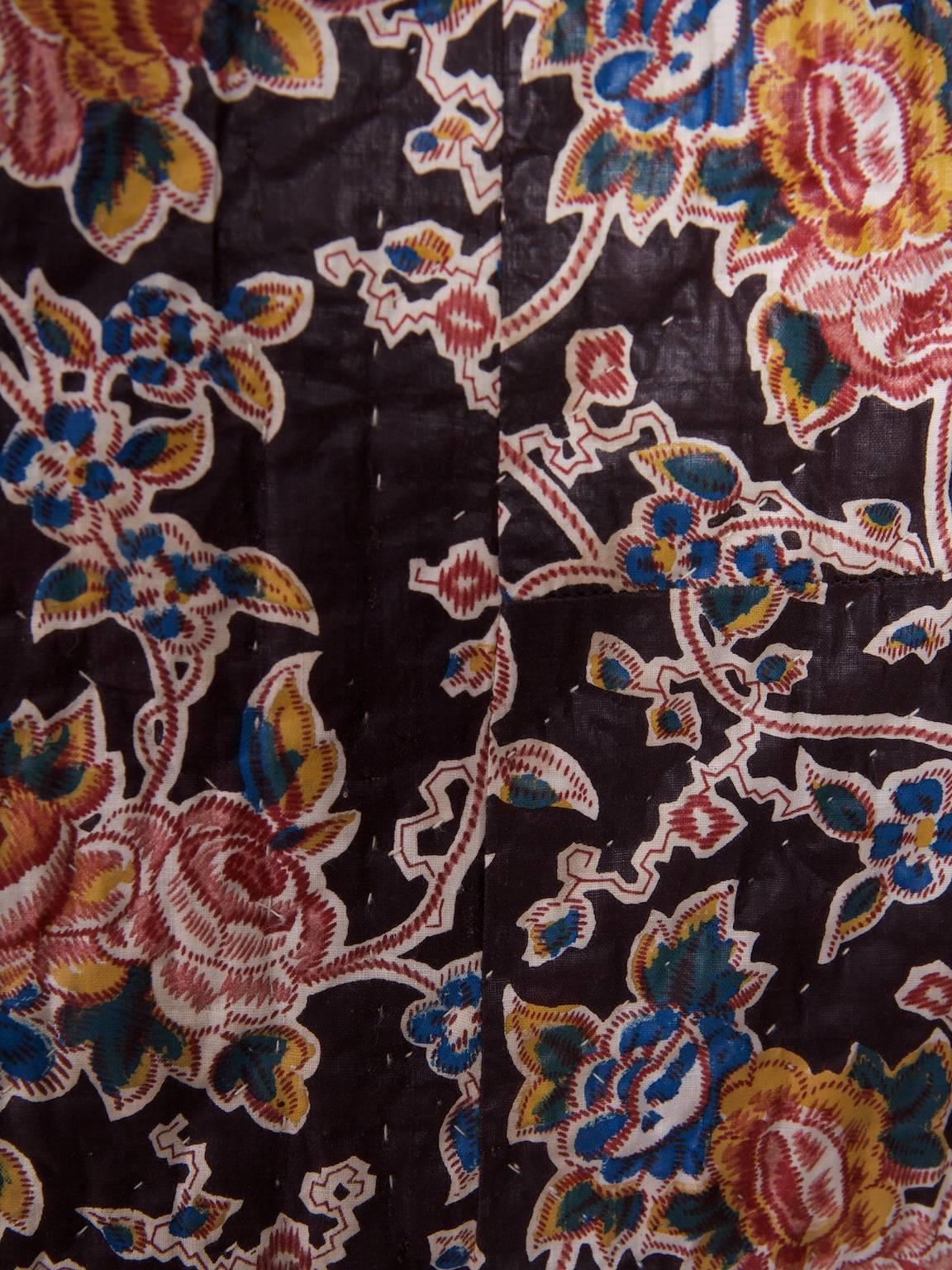 A Jersey double sided quilt.

Black chintz to one side and foliate with birds to the other.

Beautifully hand-stictched, water mark to one small area on the lighter side.

Isle of Jersey, 1940s.