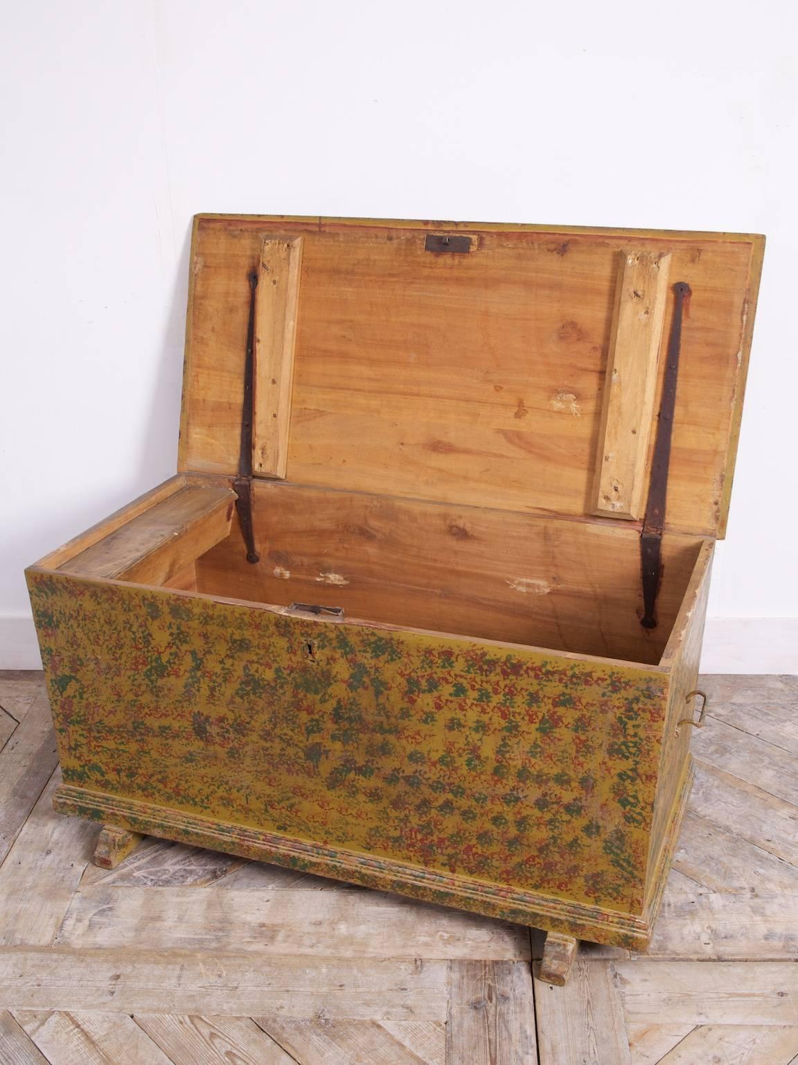 An exceptional, original painted pine trunk.

Made from large single sections of tropical hardwood and then highly decorated.

Candle box to the interior and two steel carrying handles to the sides.

European, circa 1860.
