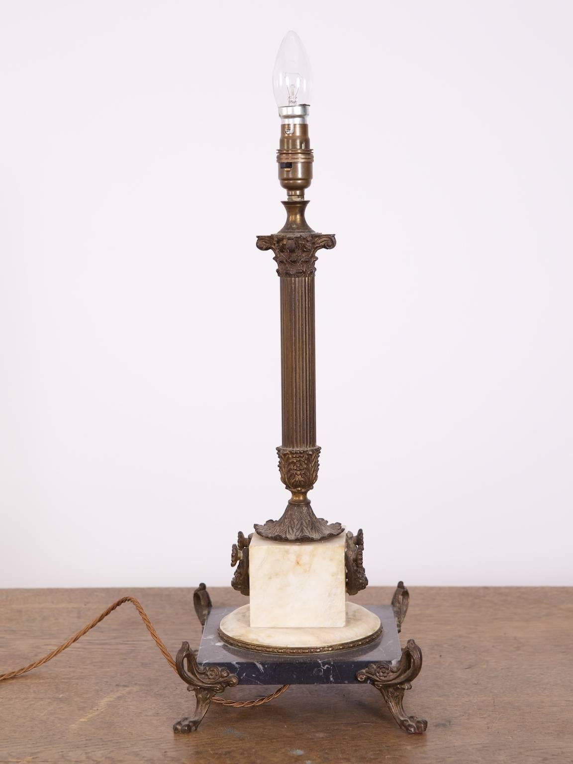 A brass and marble table lamp in the French empire taste.

Mid-20th century.

Rewired and pat tested.
    