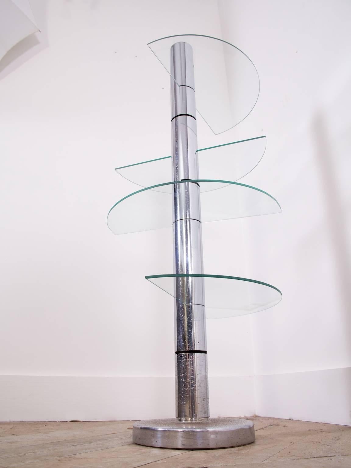 A chrome and glass pillar retail display stand by Multiform London.

Mid-Century.