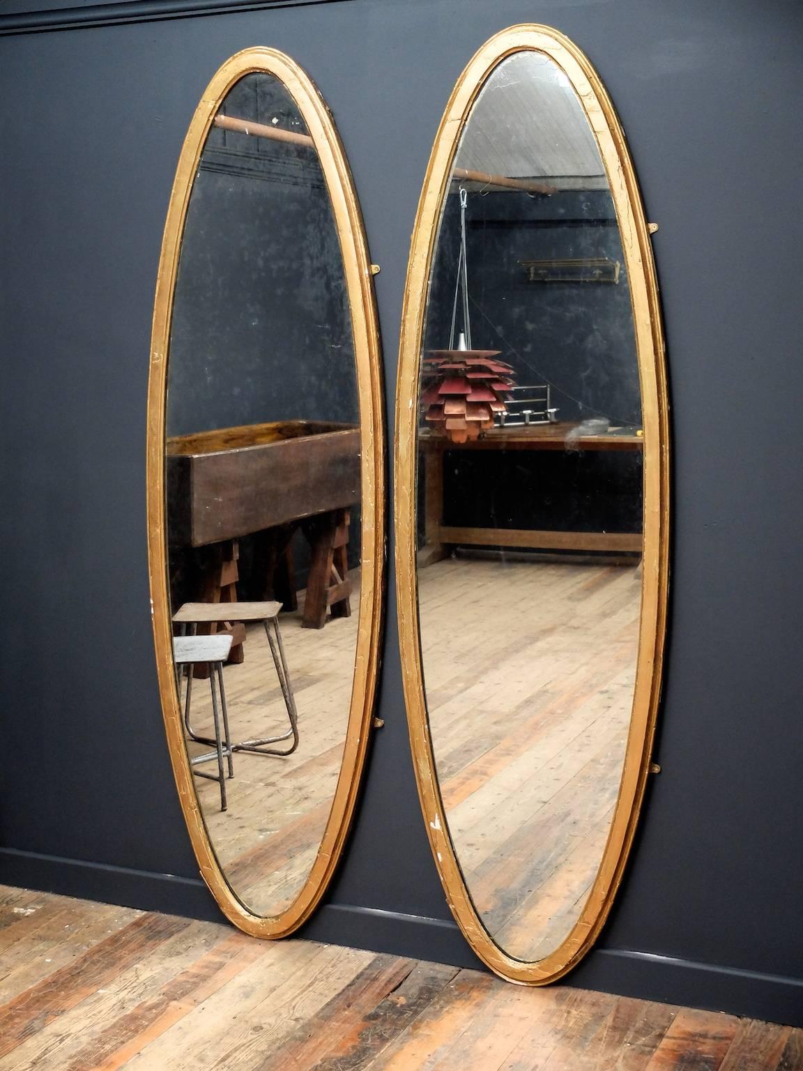 A pair of early 19th century oval pier mirrors.

Soft lightly distressed original mirror plates set in worn and flaking gilded frames with quality back boards.

Known provenance of important local estate,

Welsh, circa 1820.