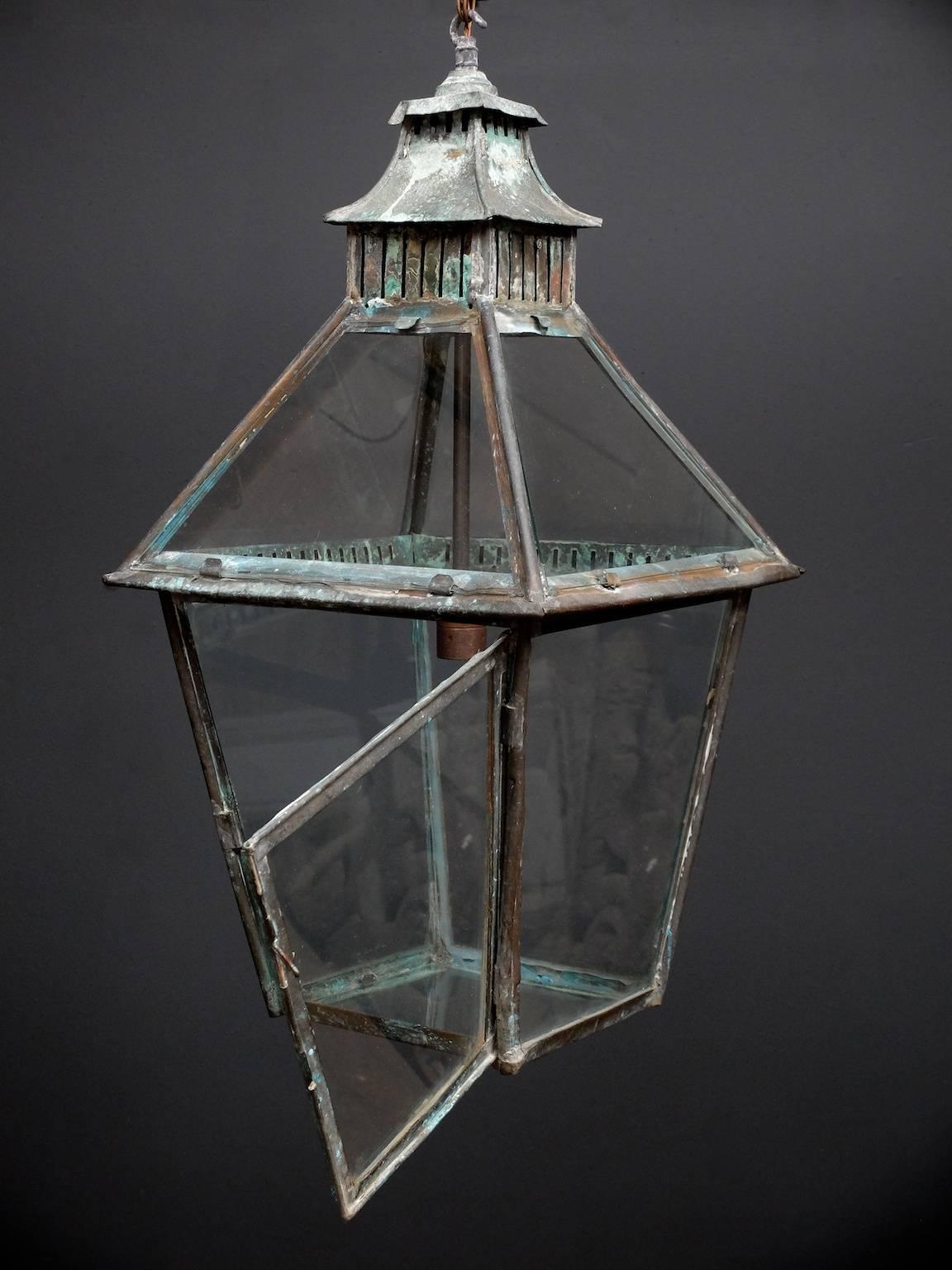 A heavily patinated copper gas lantern, now converted to electricity.
 