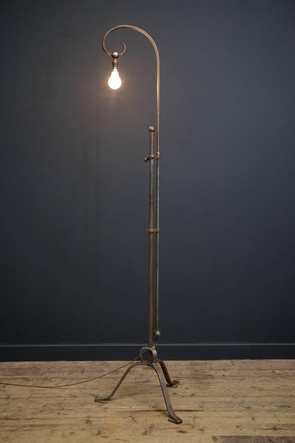A wrought iron floor lamp by Samuel 