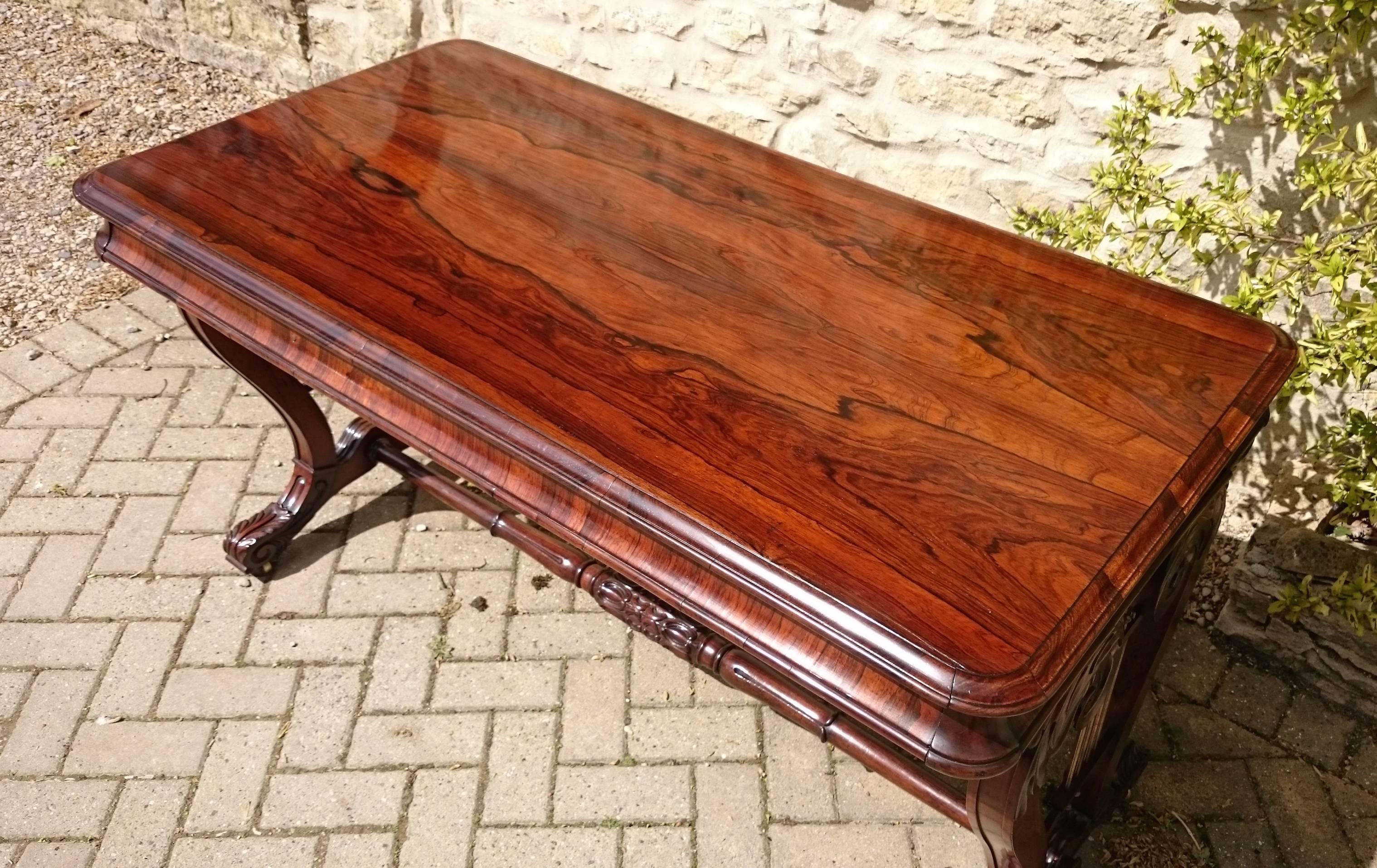 Very fine quality Regency rosewood antique writing table. This table has a thin frieze and lots of legroom for sitting if it is to be used as a desk. It is also useful as a side table or as a sofa table as it is the same height as a sofa table and