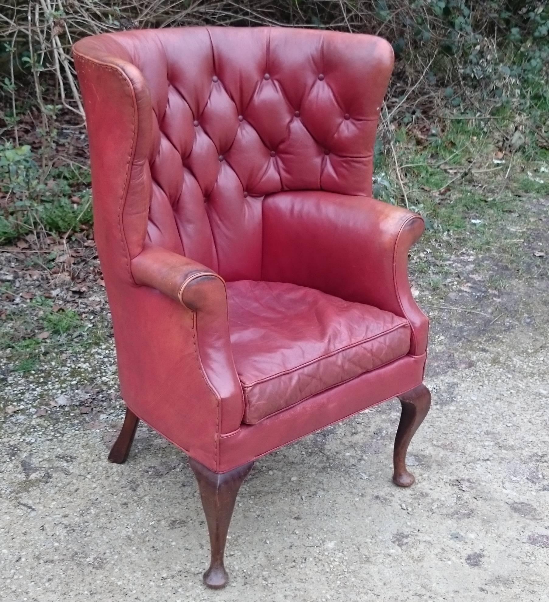 British Button Back Barrel Back Leather Wing Chair by Howard and Sons of London