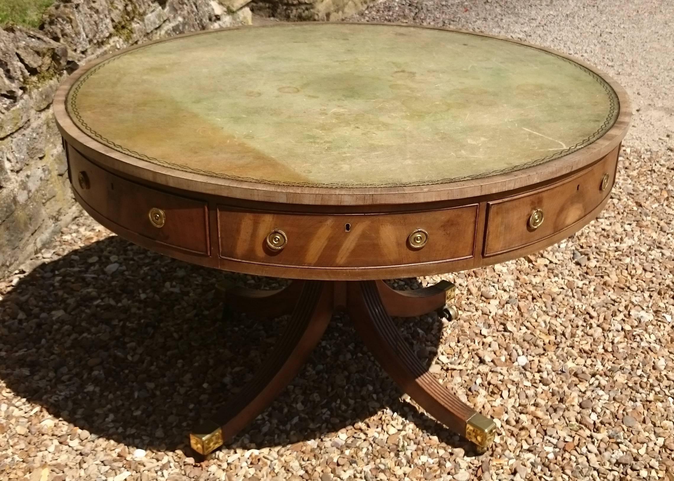 This is a very fine quality 18th century antique library 'drum' table. This library table has a rotating top which means lots of work spread over the writing surface can be accessed by simply spinning the top. This particular table has five drawers,