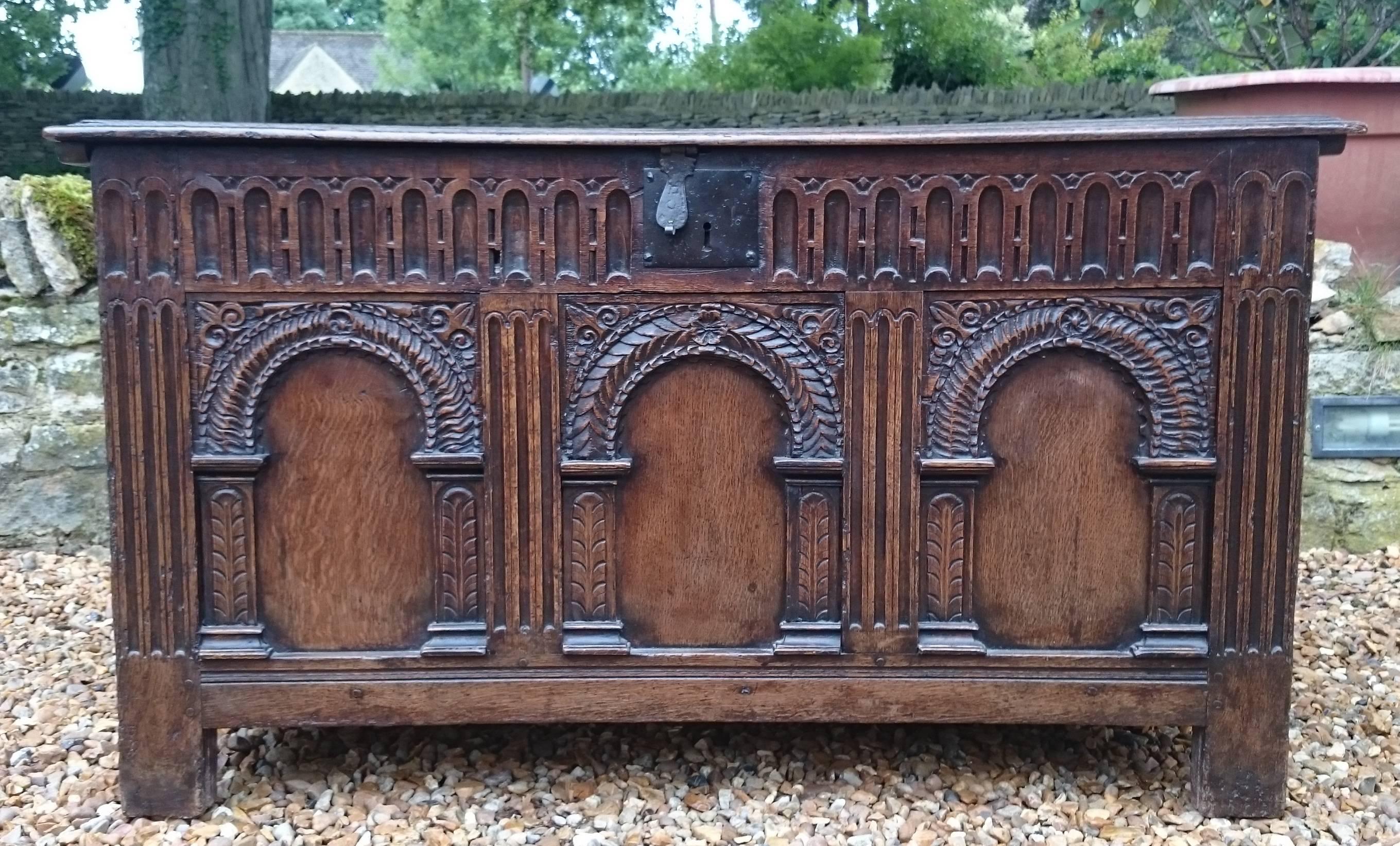 This is an especially fine 17th century oak coffer. It is finely carved with fluted pilasters and arched panels. The oak is a wonderful colour to which these photographs to not do justice. The lock and hinges look original, although the hinges may
