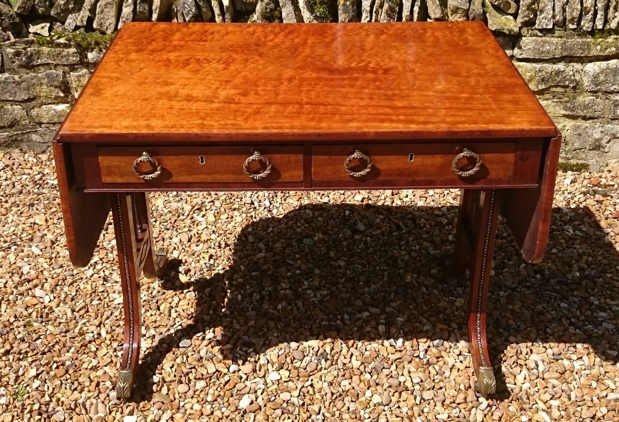 This is a very fine quality antique sofa table which must have cost a fortune as a new order. It would be hard to find anything lacking in any area at all, this table has it all. From the top down, it has the best quality mahogany top that we have