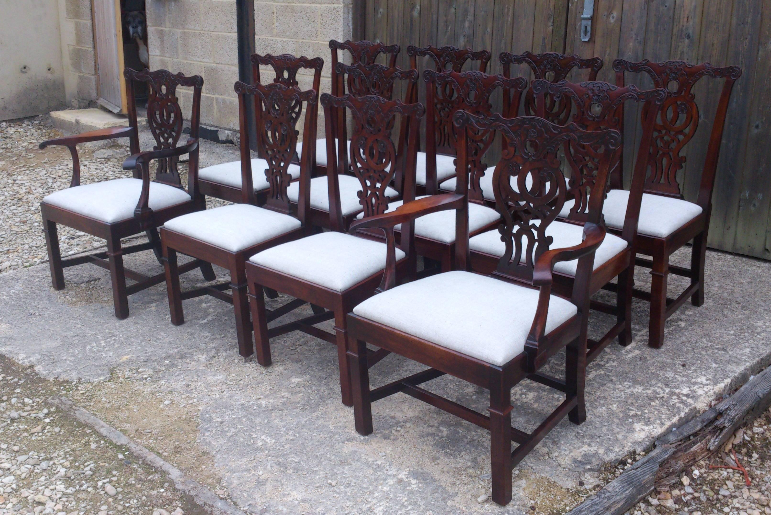 This set of 12 19th century antique Chippendale dining chairs are made to a design that originated in the George III period of the 18th century. These antique dining chairs are large, solid and made of a good quality dense grained mahogany. The