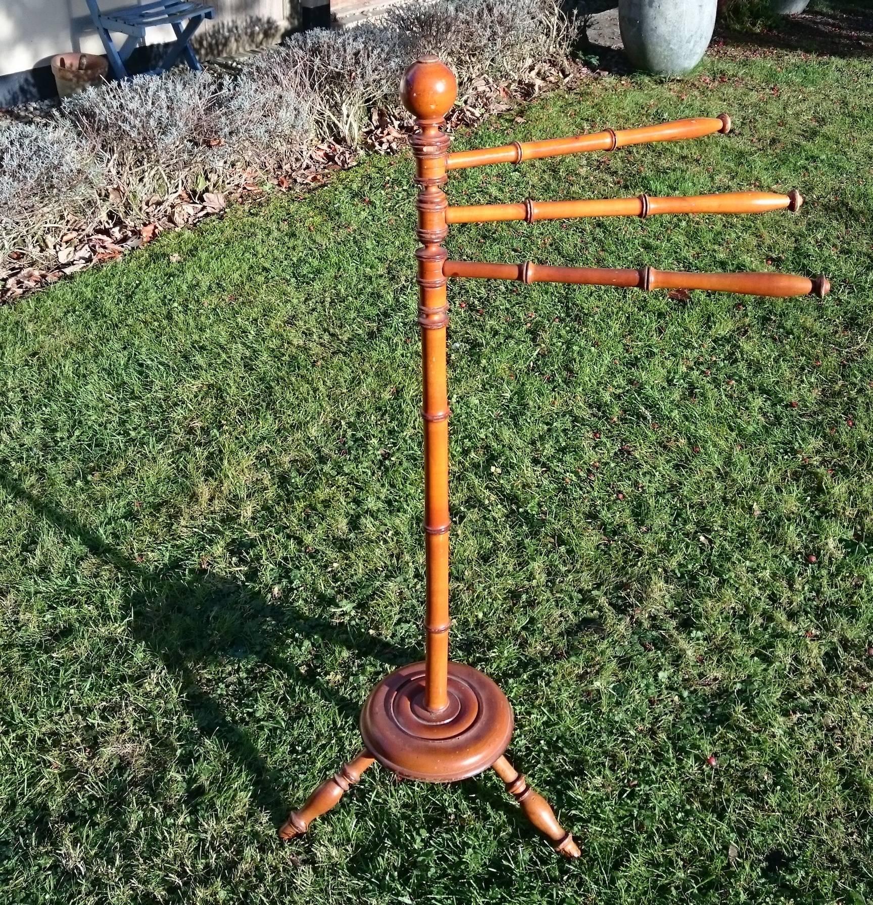 Antique washer - dryer.

19th century Victorian period simulated bamboo antique towel rail. This charming and useful little towel rail stands of three turned legs and has three hanging arms, all of which rotate though 365 degrees. This one has the