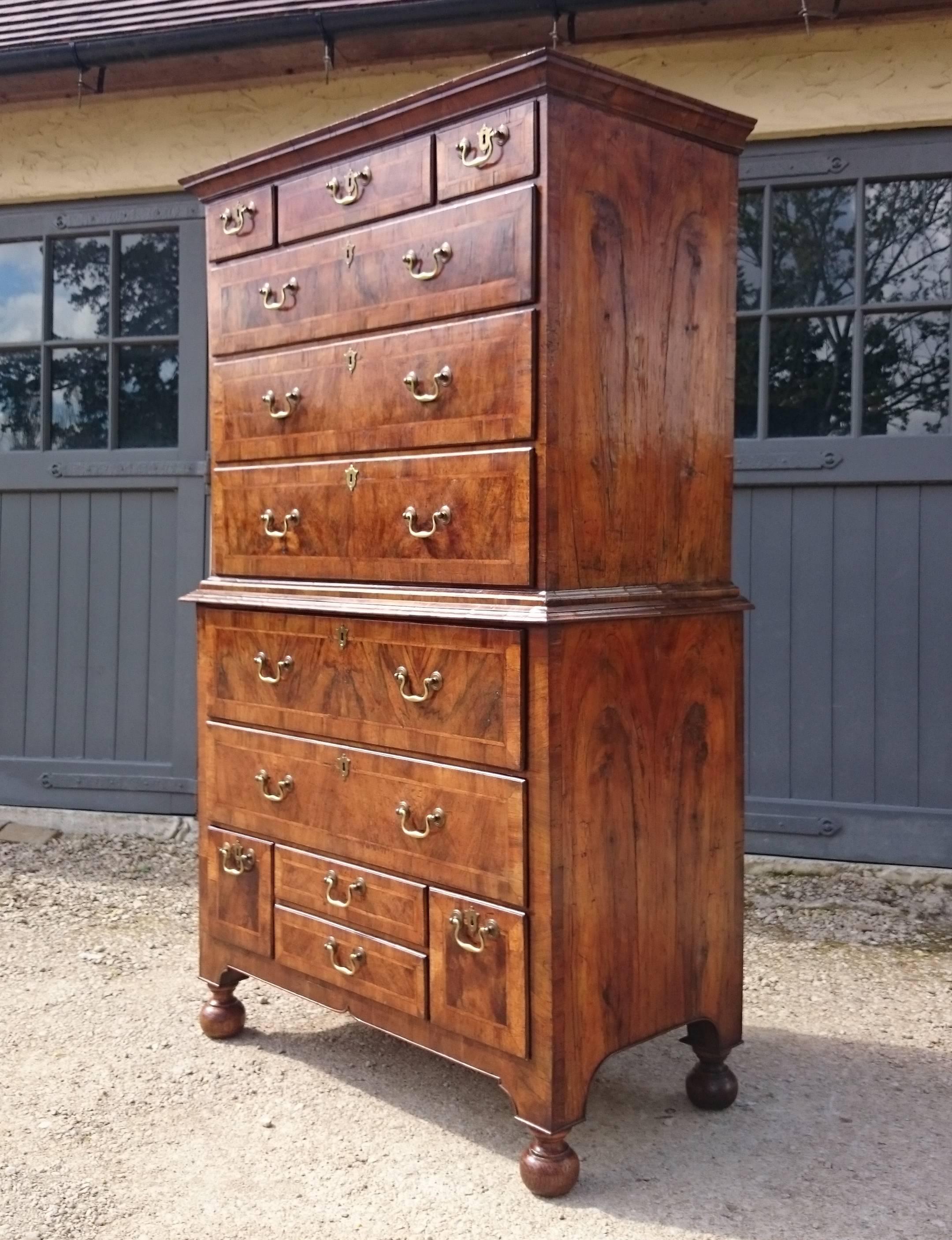 Antique chest on chest made of book matched walnut with banding round the drawers. This chest of drawers is a good early one and has been in the same family for over a hundred years. It is in great untouched original condition. Pictured here before