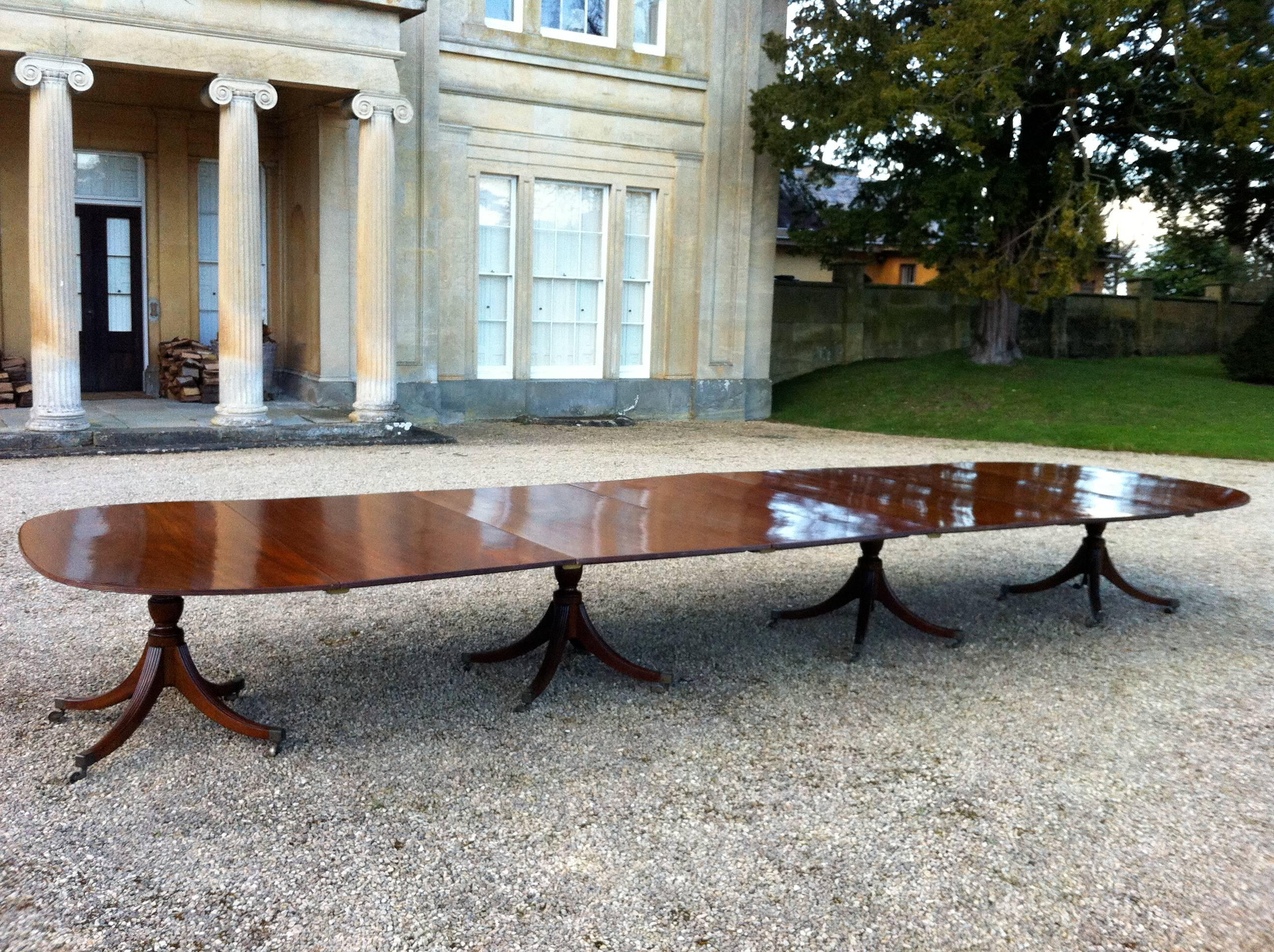 Extremely fine and rare late 18th century mahogany four pedestal dining table attributed to Gillow. English, circa 1790. All original, this dining table bears the label or Stair and Andrew who supplied it to the previous owners around