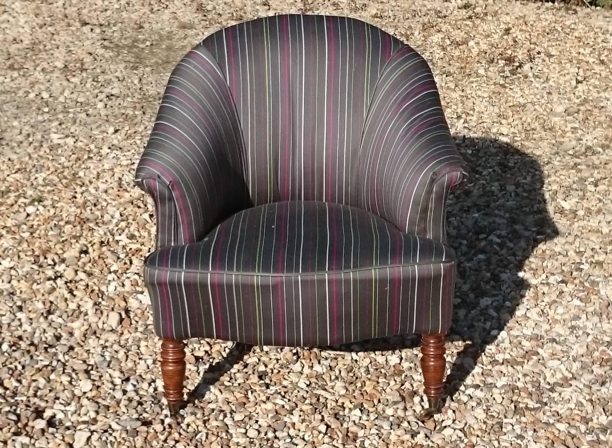 Antique tub chairs standing on turned front legs with recent fabric and casters all round, this chairs was upholstered by the previous owners and looks to be in good condition although not restored in our workshops, sold as is or ask for quote to
